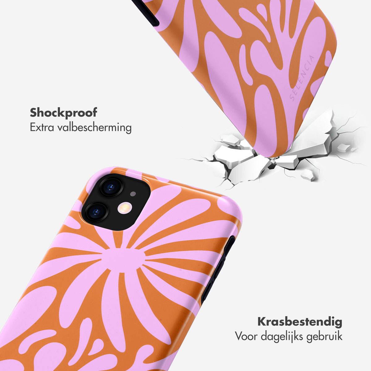 Coques de téléphone avec un design floral. Une coque est cassée. La coque est orange et rose.