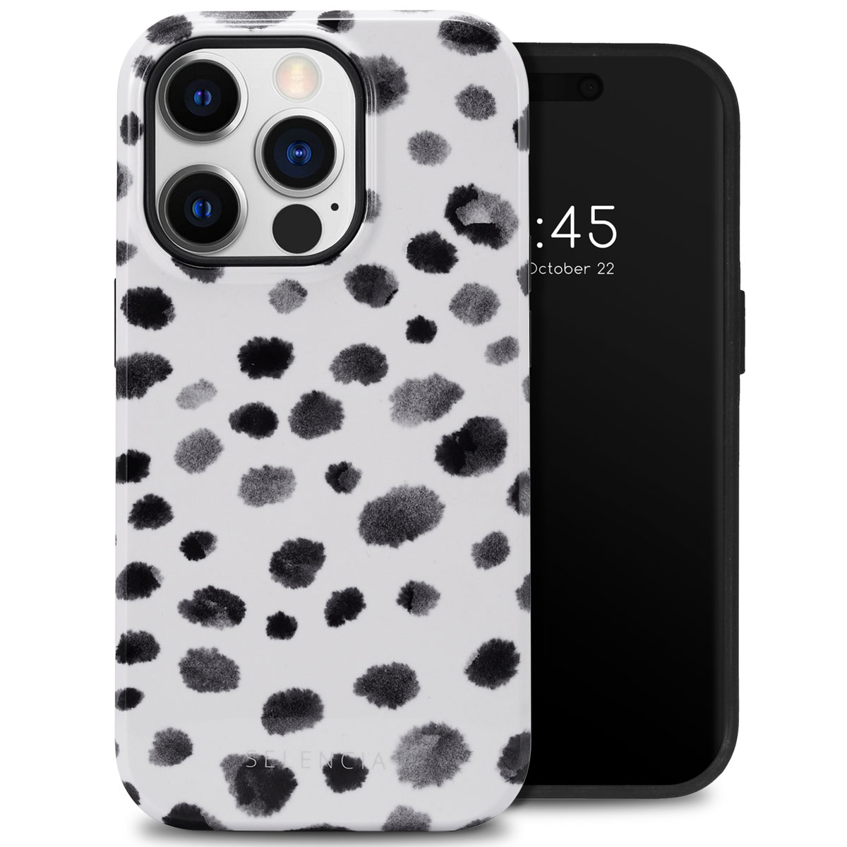 Witte telefoonhoes met zwarte stippen, naast een telefoon. De hoes heeft een glanzende afwerking.