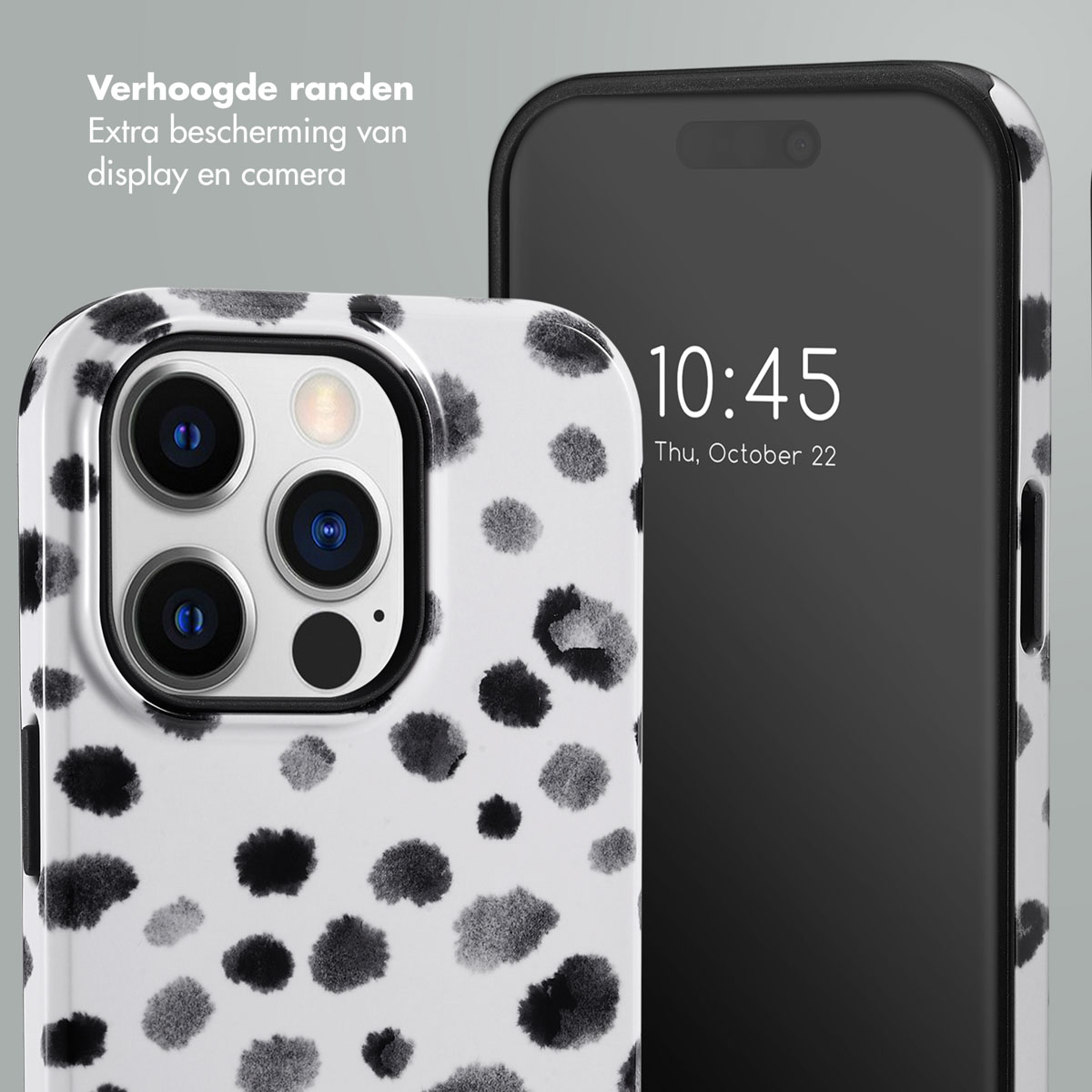Telefoonhoes met zwart-witte stippen. Telefoon zit erin.
