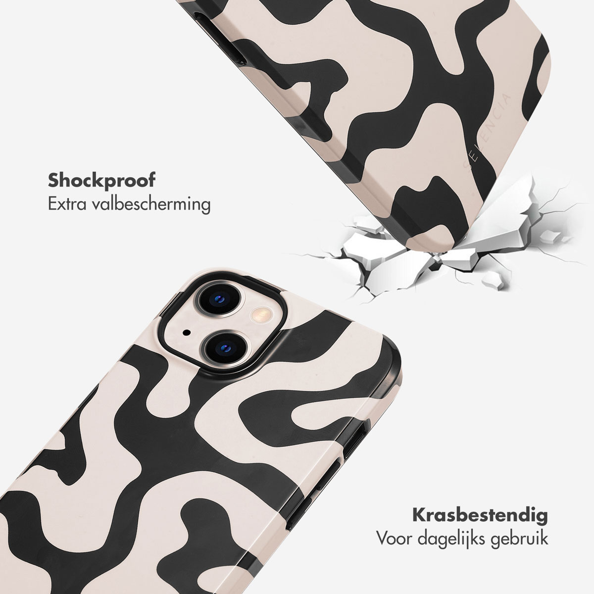 Une coque de téléphone à motif noir et blanc tombe et se brise au sol.