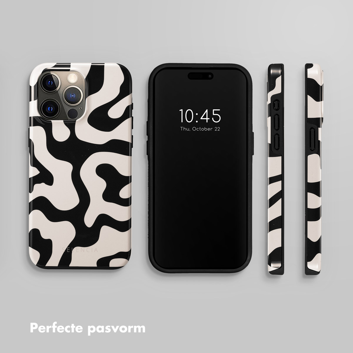 Un smartphone avec une coque à motif noir et blanc, à côté de trois autres coques.
