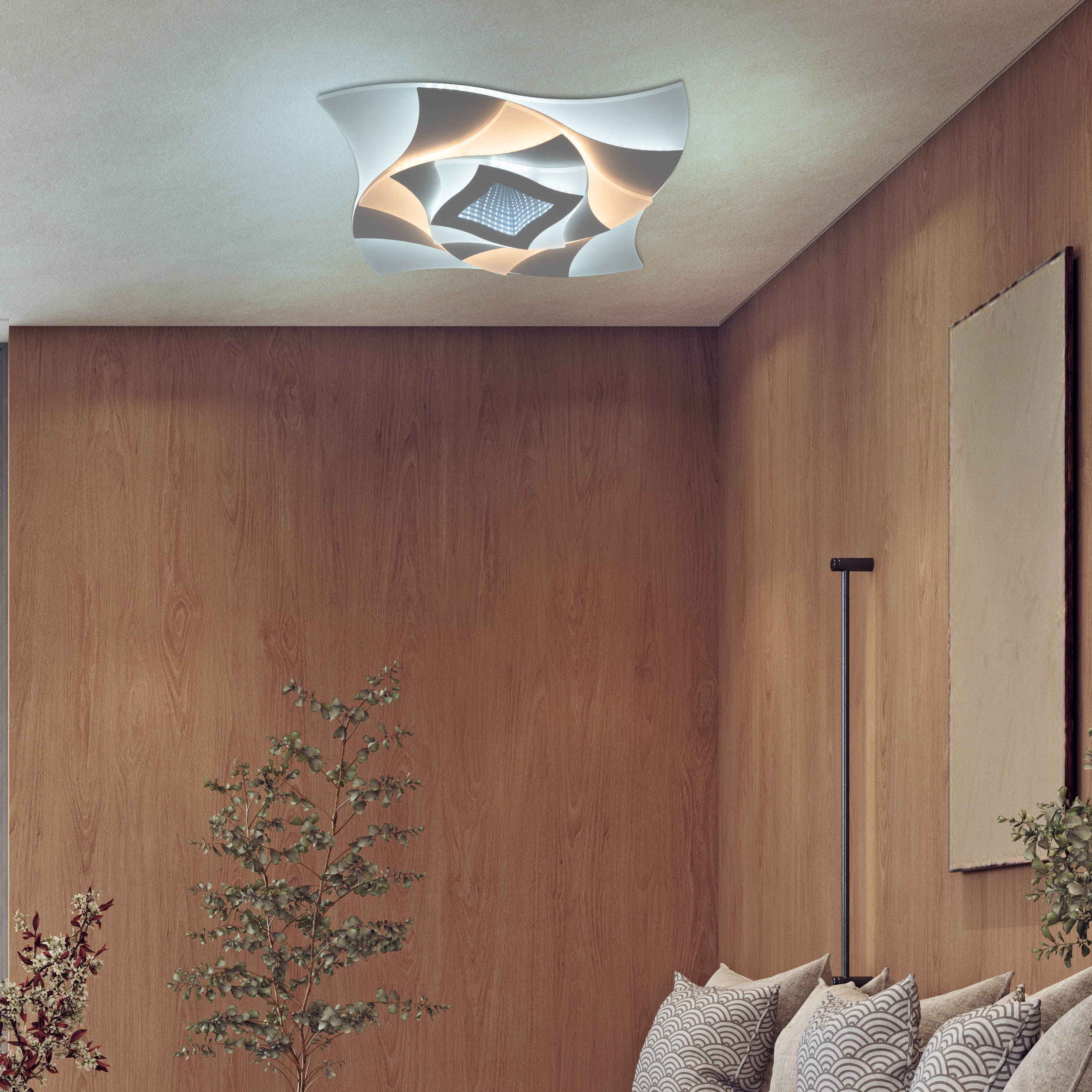 Eine moderne Deckenleuchte in einem weißen und goldenen Wirbeldesign, installiert in einem Raum.