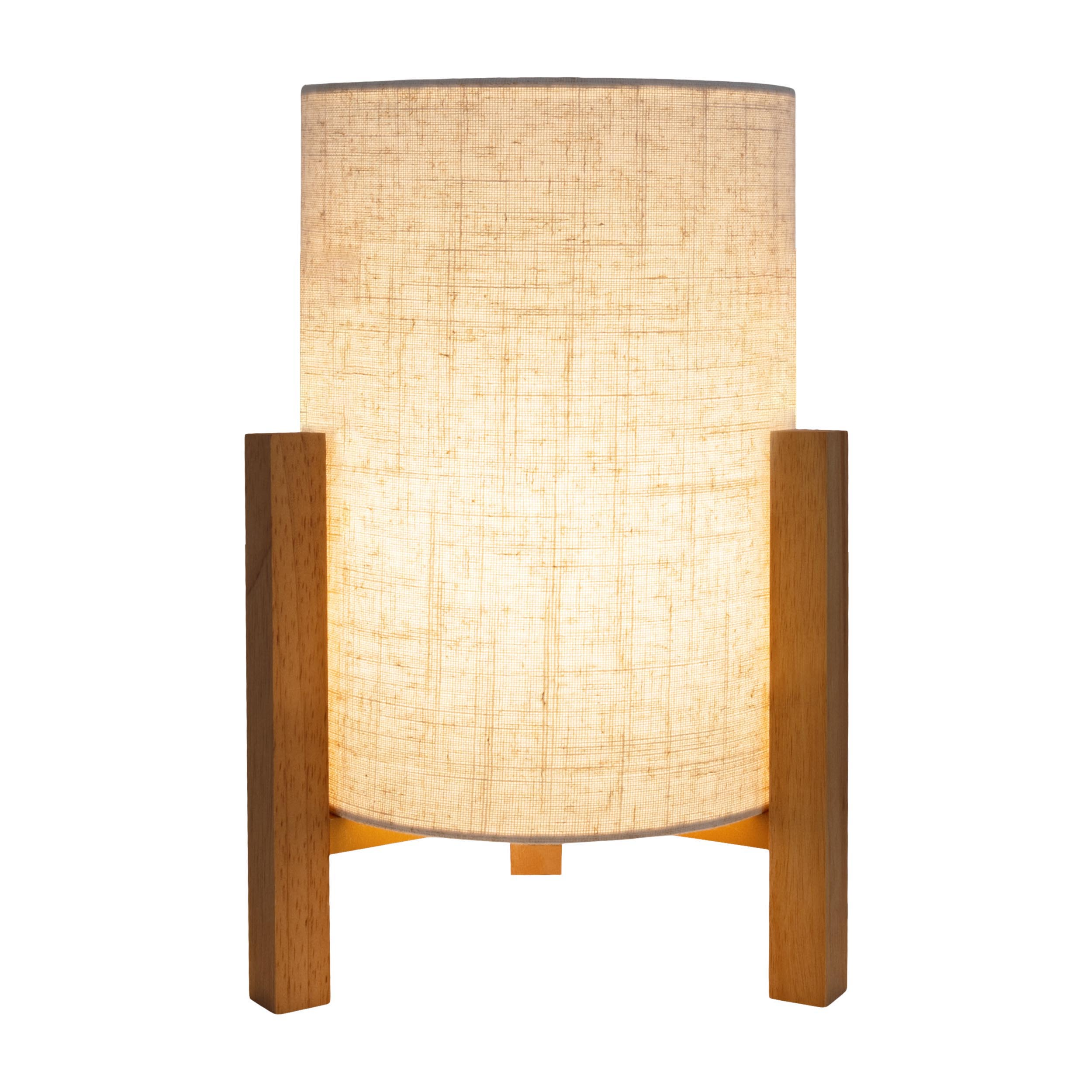 Una piccola lampada da tavolo con un paralume cilindrico beige su una struttura in legno.