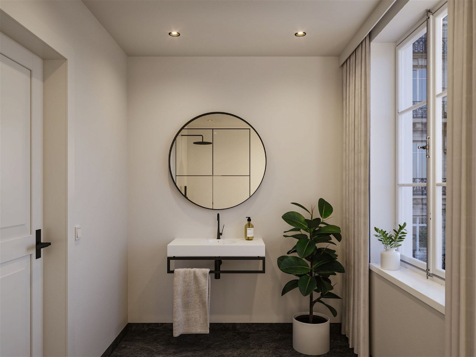 Łazienka z okrągłym lustrem, umywalką i rośliną w białej doniczce.
