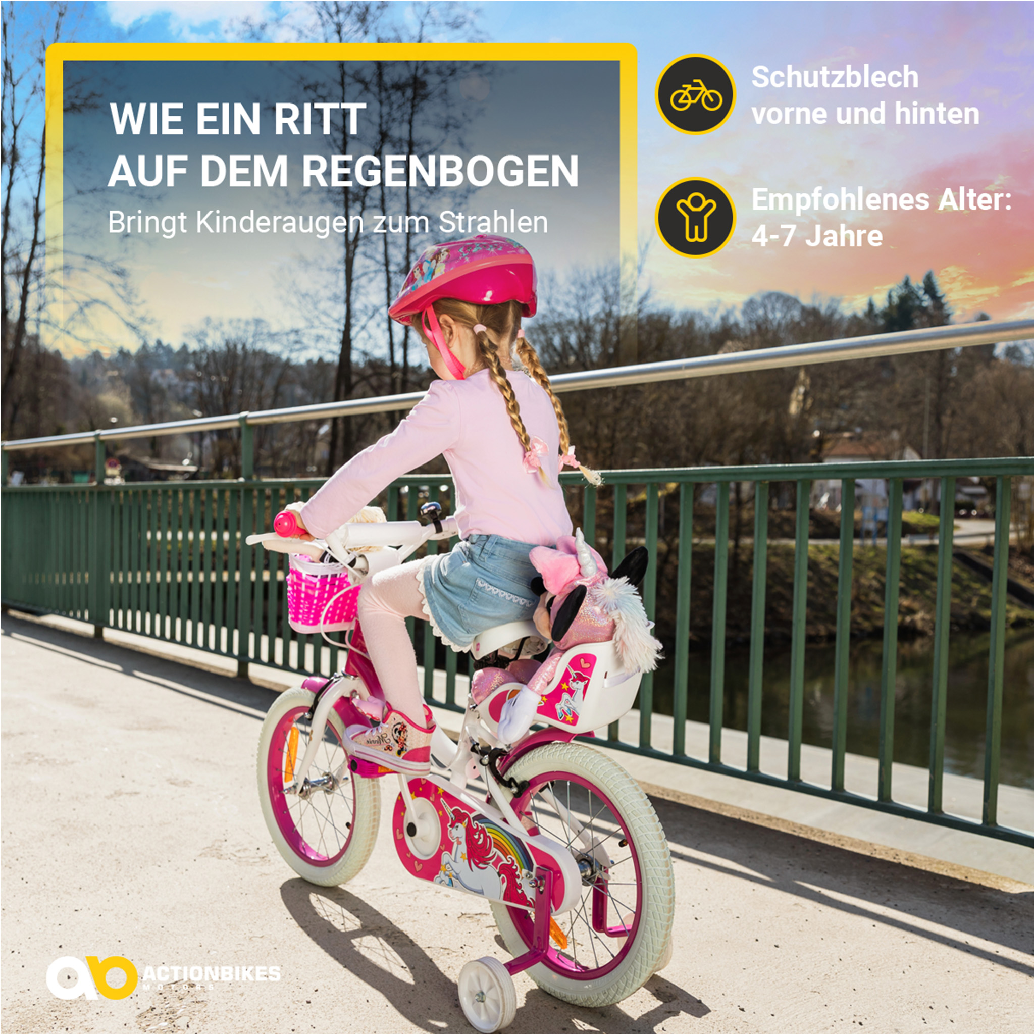 Ein Mädchen fährt Fahrrad mit Stützrädern. Text: Wie ein Ritt auf dem Regenbogen.