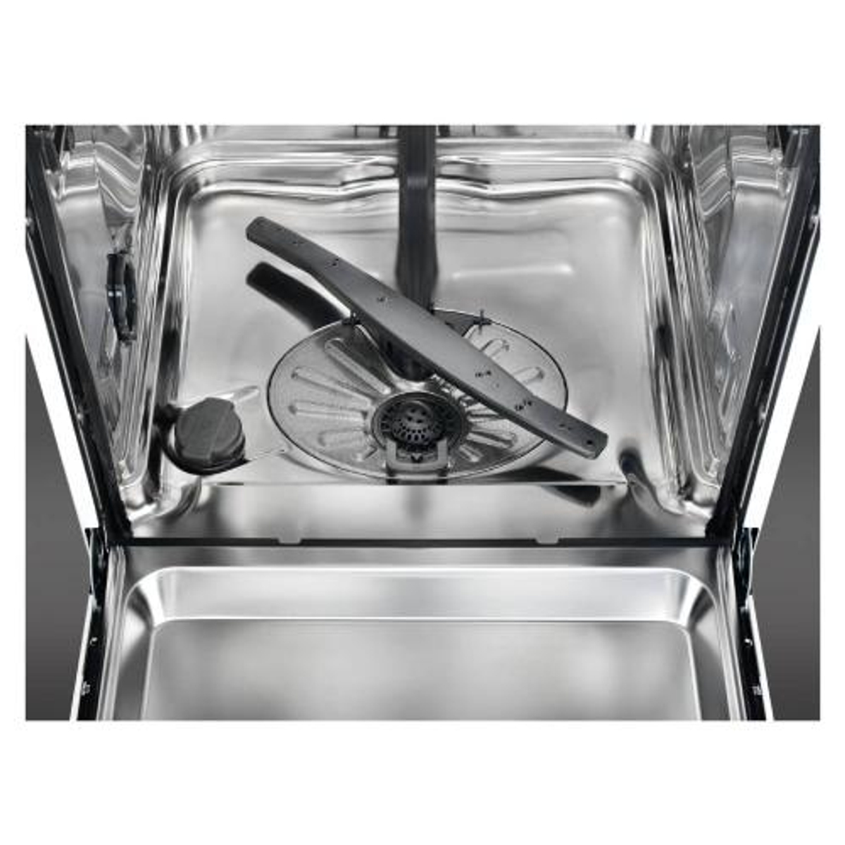 Wnętrze zmywarki. Jest spryskiwacz wody i stojak na naczynia.