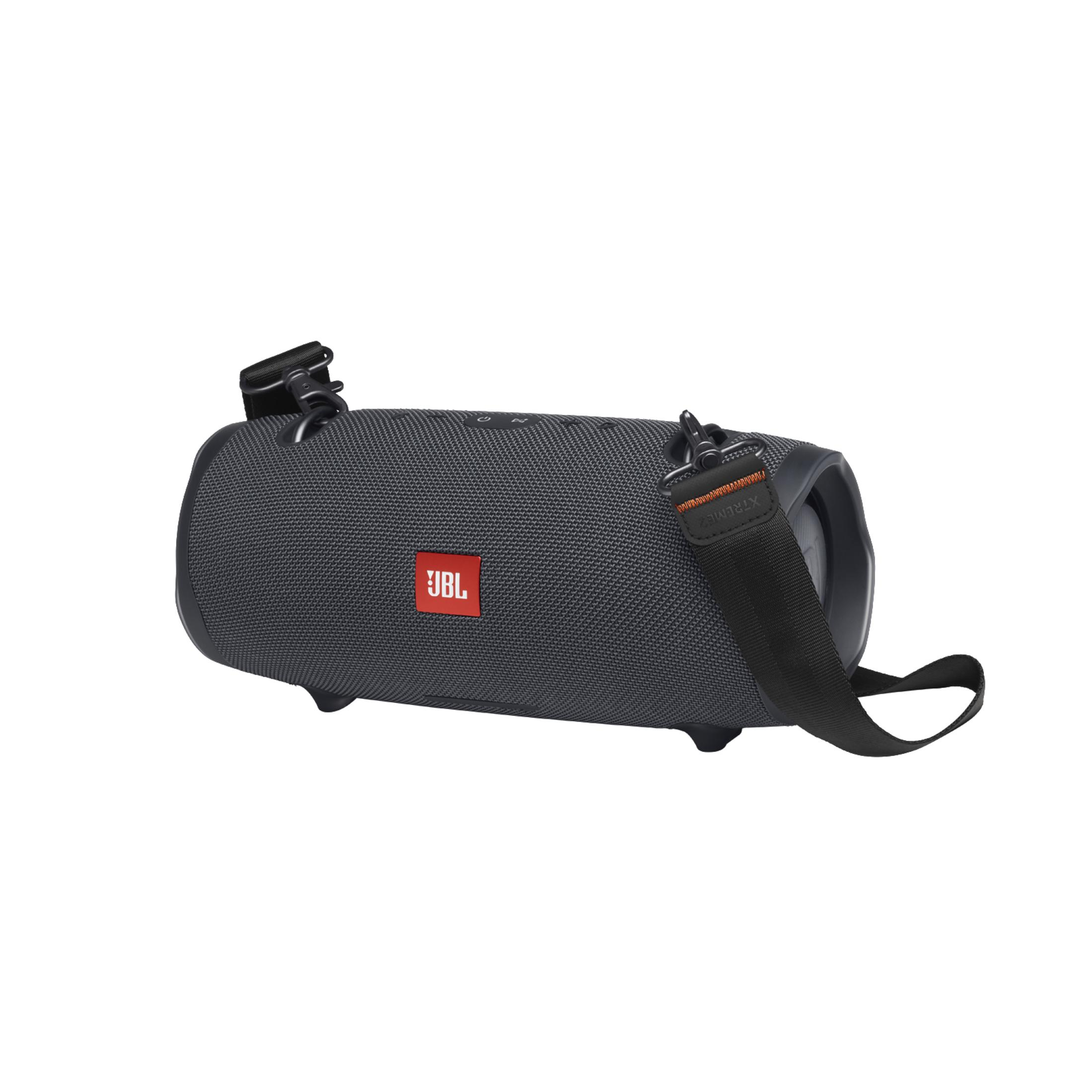 Dunkelgrauer tragbarer JBL-Lautsprecher mit schwarzem Gurt und rotem JBL-Logo auf weißem Hintergrund.