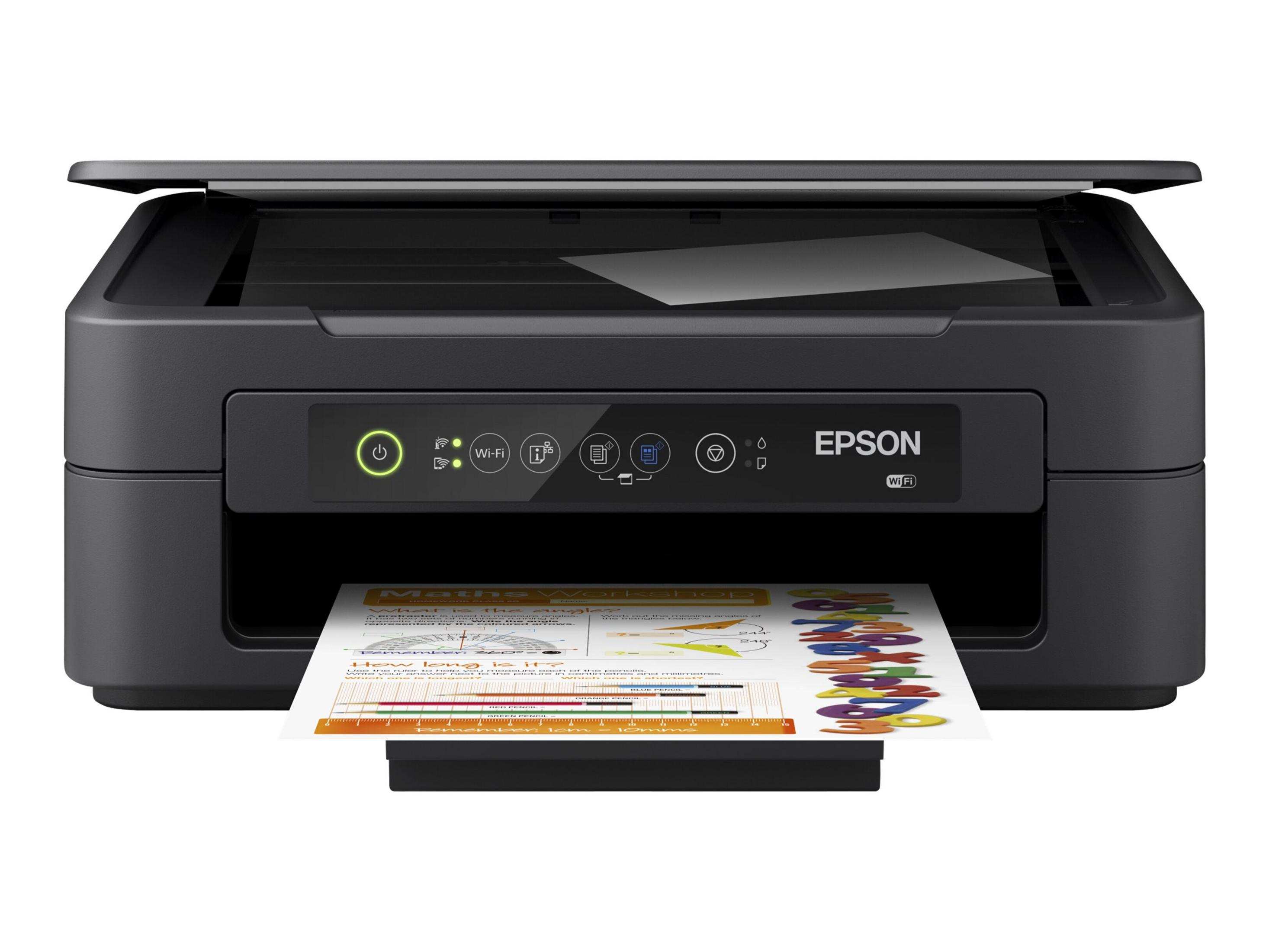 Impresora Epson negra imprimiendo una página con formas y texto coloridos. La impresora está sobre un fondo blanco.