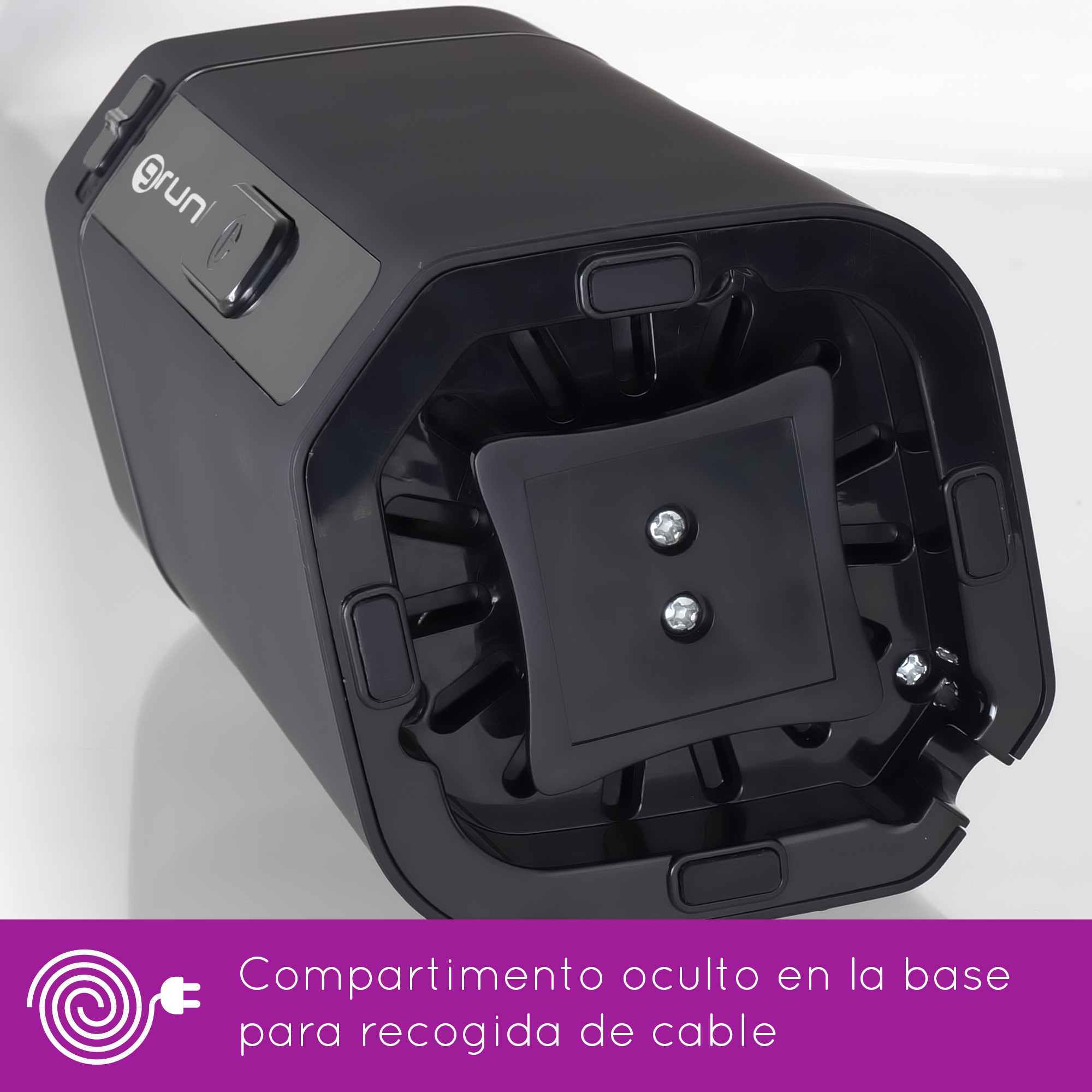 Vista inferior de un aparato negro con botones y compartimento oculto para cable.