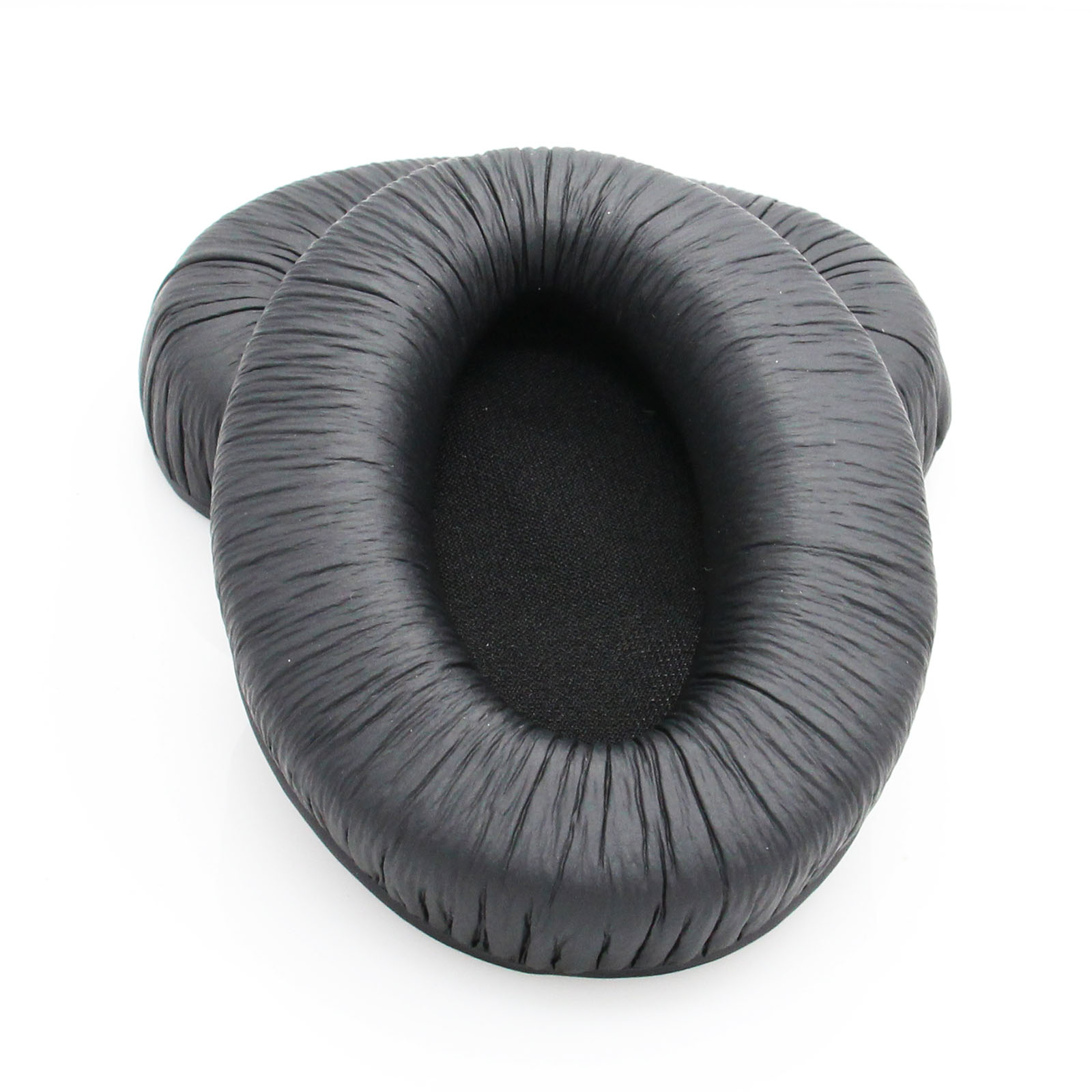 Deux coussinets d'oreille noirs et ovales. Ils semblent doux, avec une surface centrale texturée.