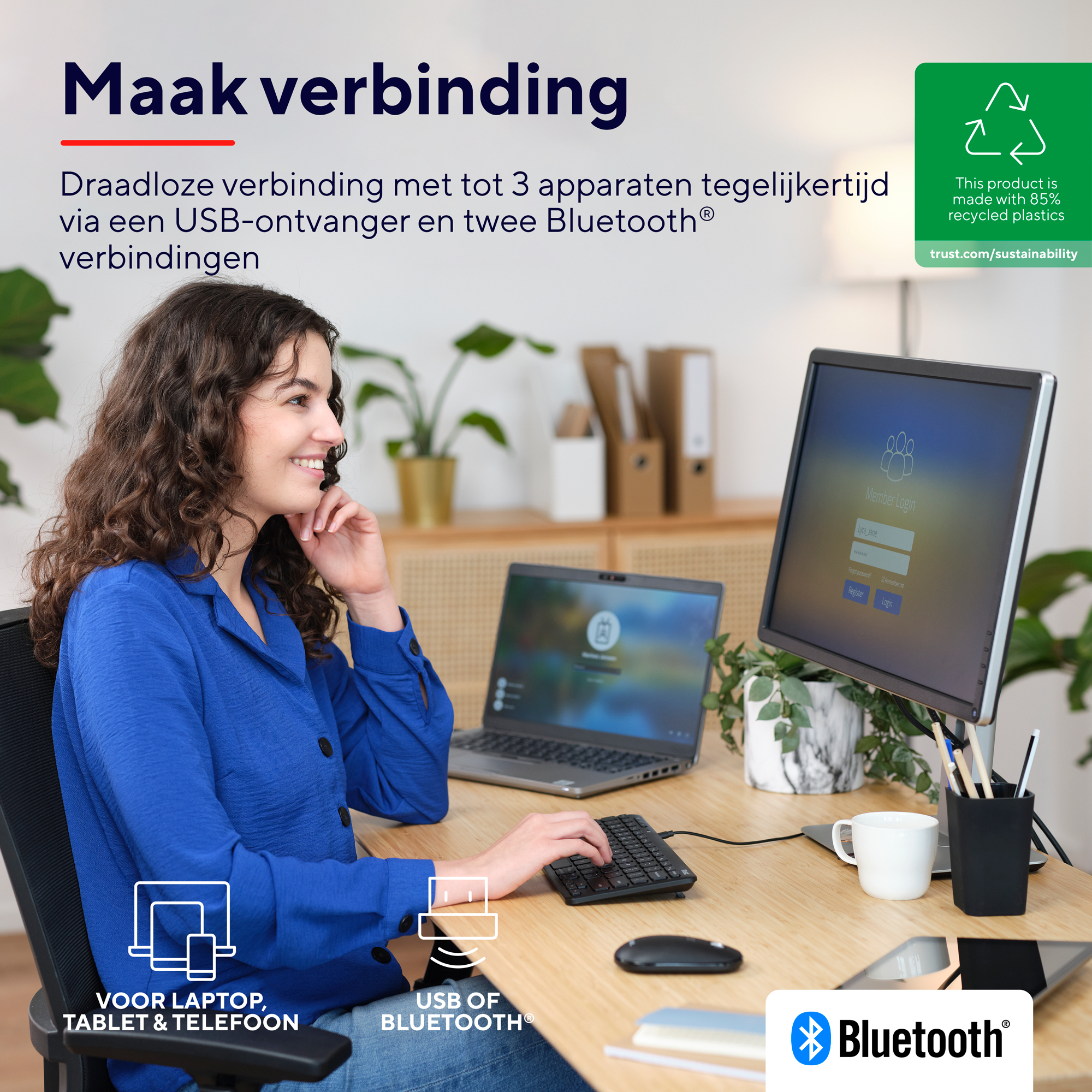 Kobieta przy biurku z laptopem, monitorem, klawiaturą i akcesoriami. Tekst brzmi 'Maak verbinding'.
