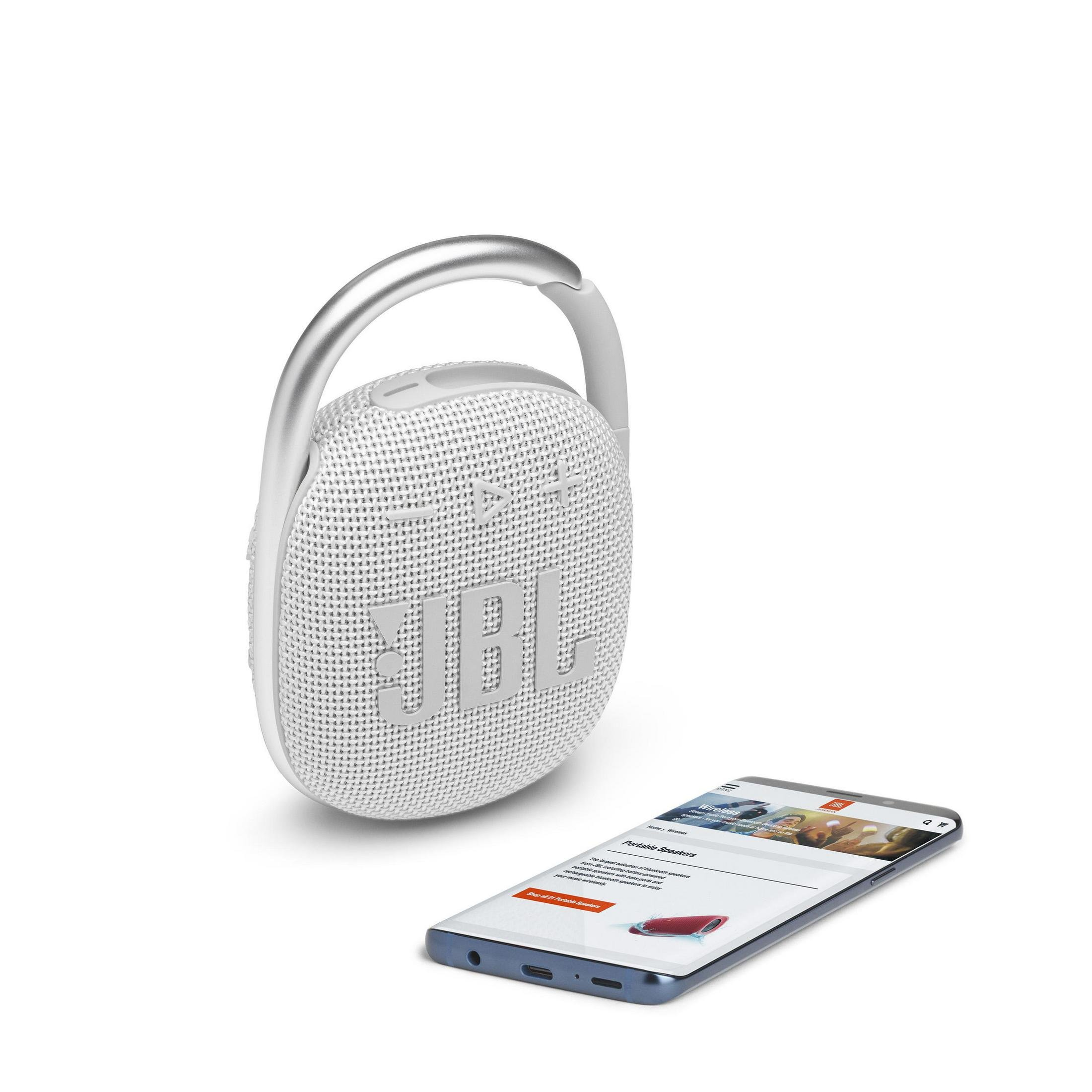Altavoz JBL blanco con asa plateada y un smartphone al lado.