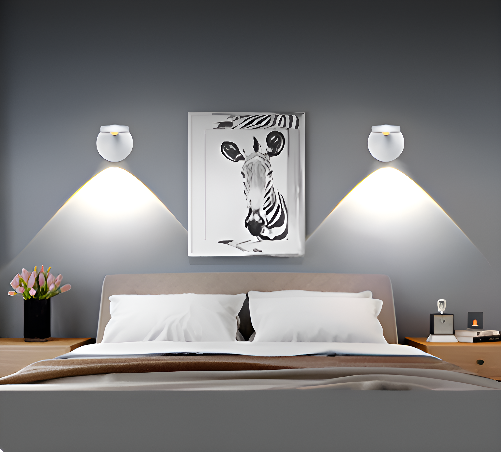 Ein Schlafzimmer mit zwei Wandlampen und einem Zebra-Bild über dem Bett.