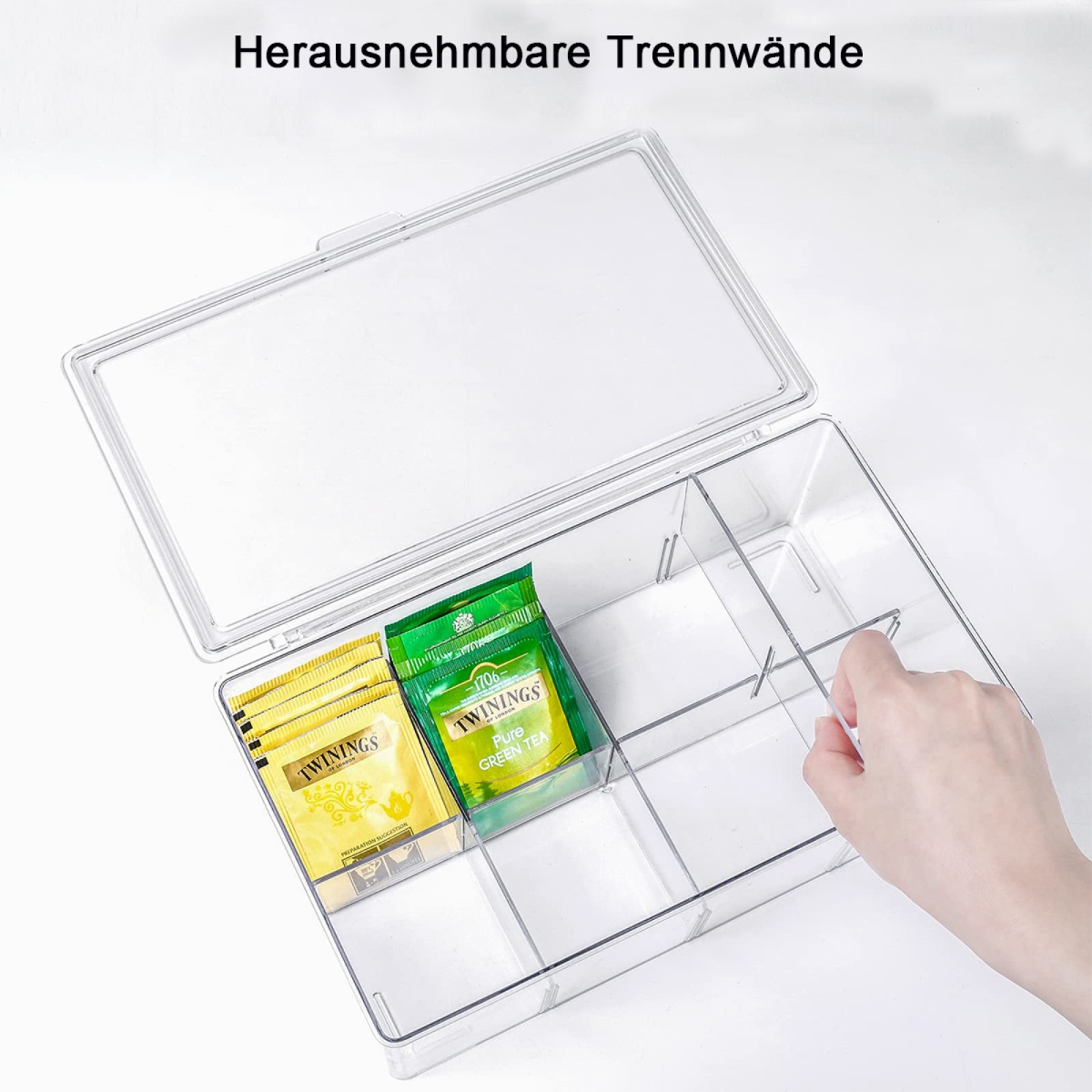 Transparente Teebox mit Trennwänden, gefüllt mit Teebeuteln.