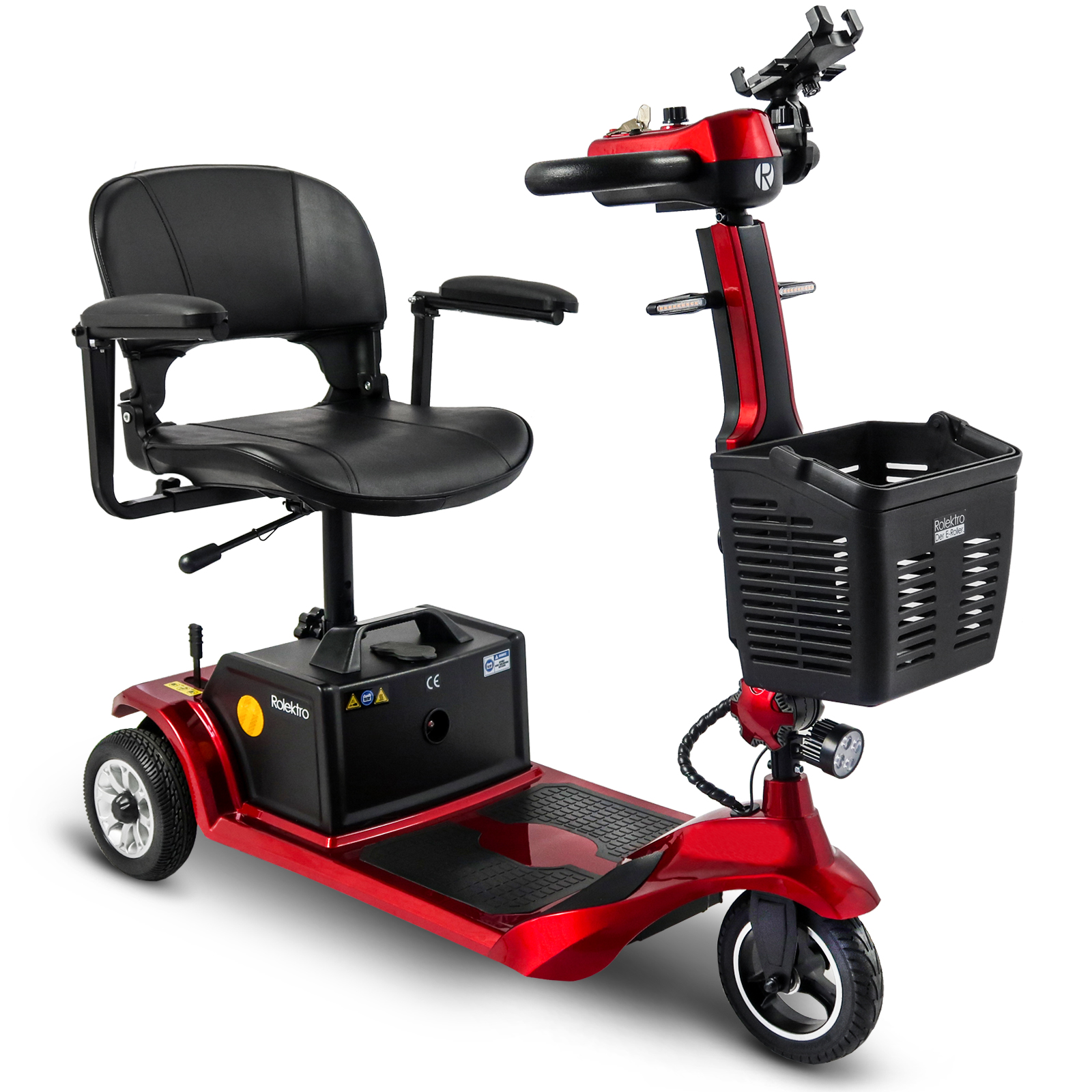 Roter Mobilitätsscooter mit schwarzem Sitz und Korb. Verfügt über drei Räder und ein Bedienfeld.