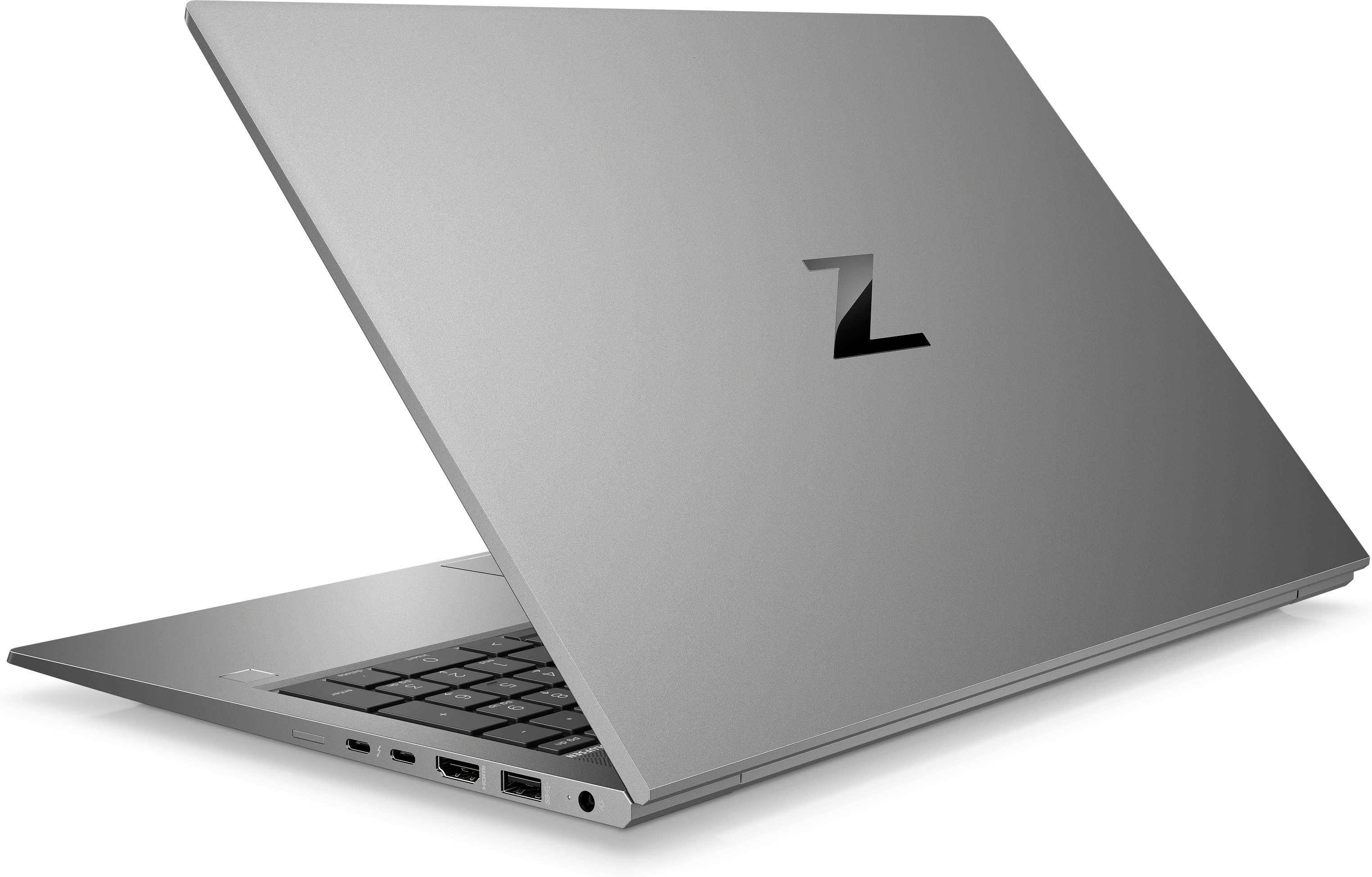 Ein silberner Laptop mit schwarzem Z-Logo auf der Rückseite, leicht angewinkelt auf weißem Hintergrund.