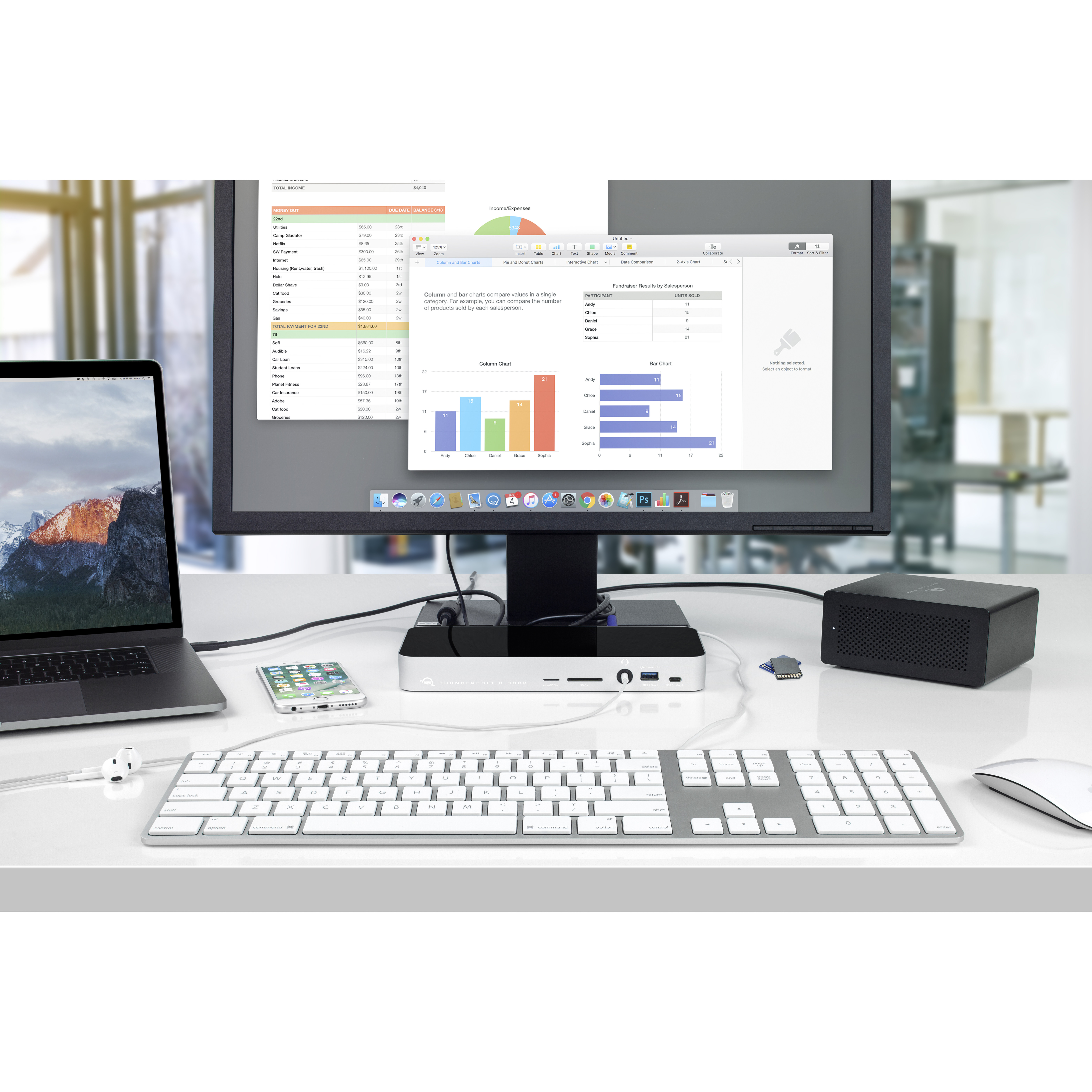 Ein Schreibtisch-Setup mit Monitor, Laptop, Tastatur, Maus und externer Festplatte. Daten werden angezeigt.