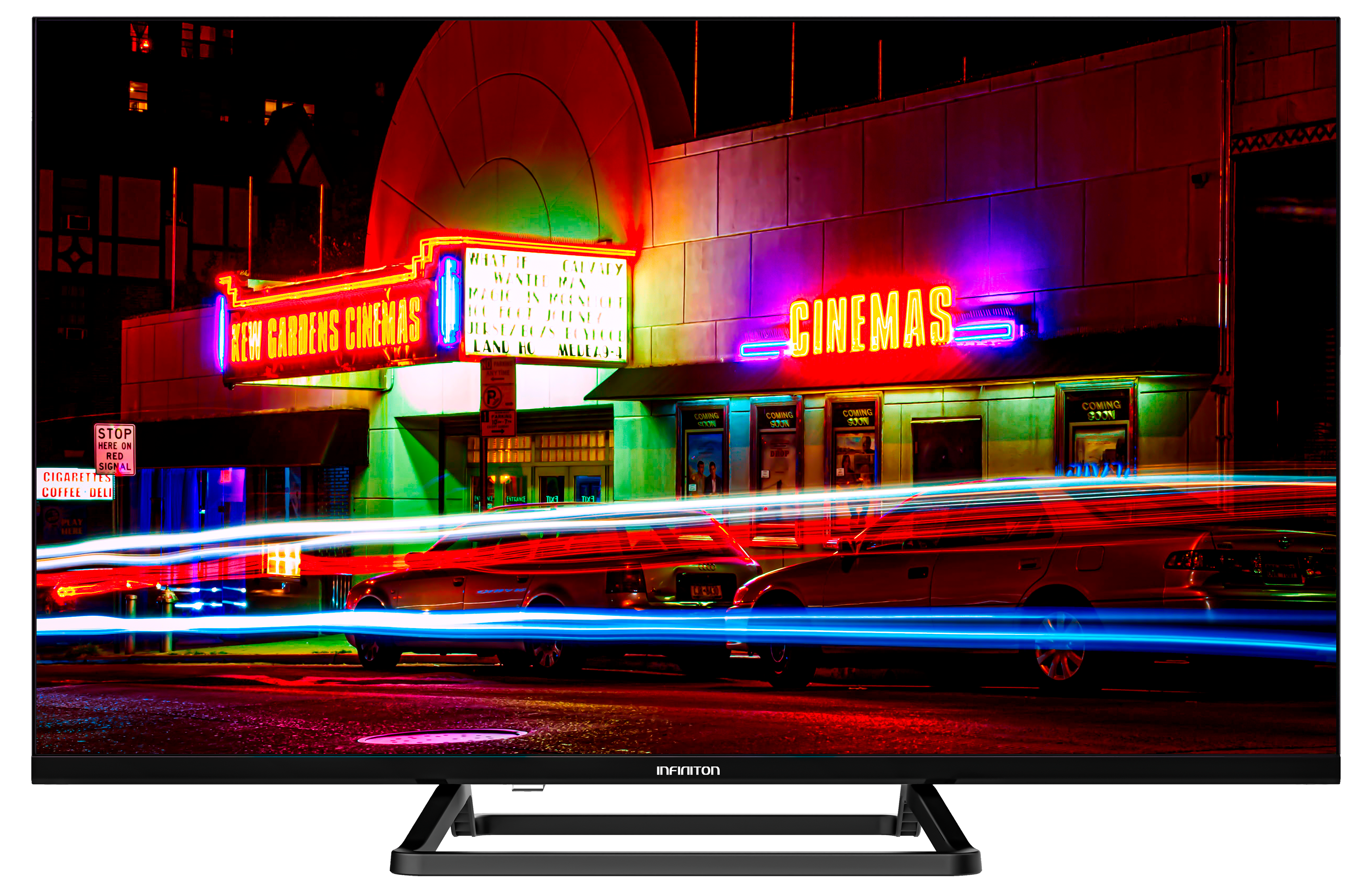Un televisor de pantalla ancha muestra un cine de noche con letreros de neón y luces de autos.