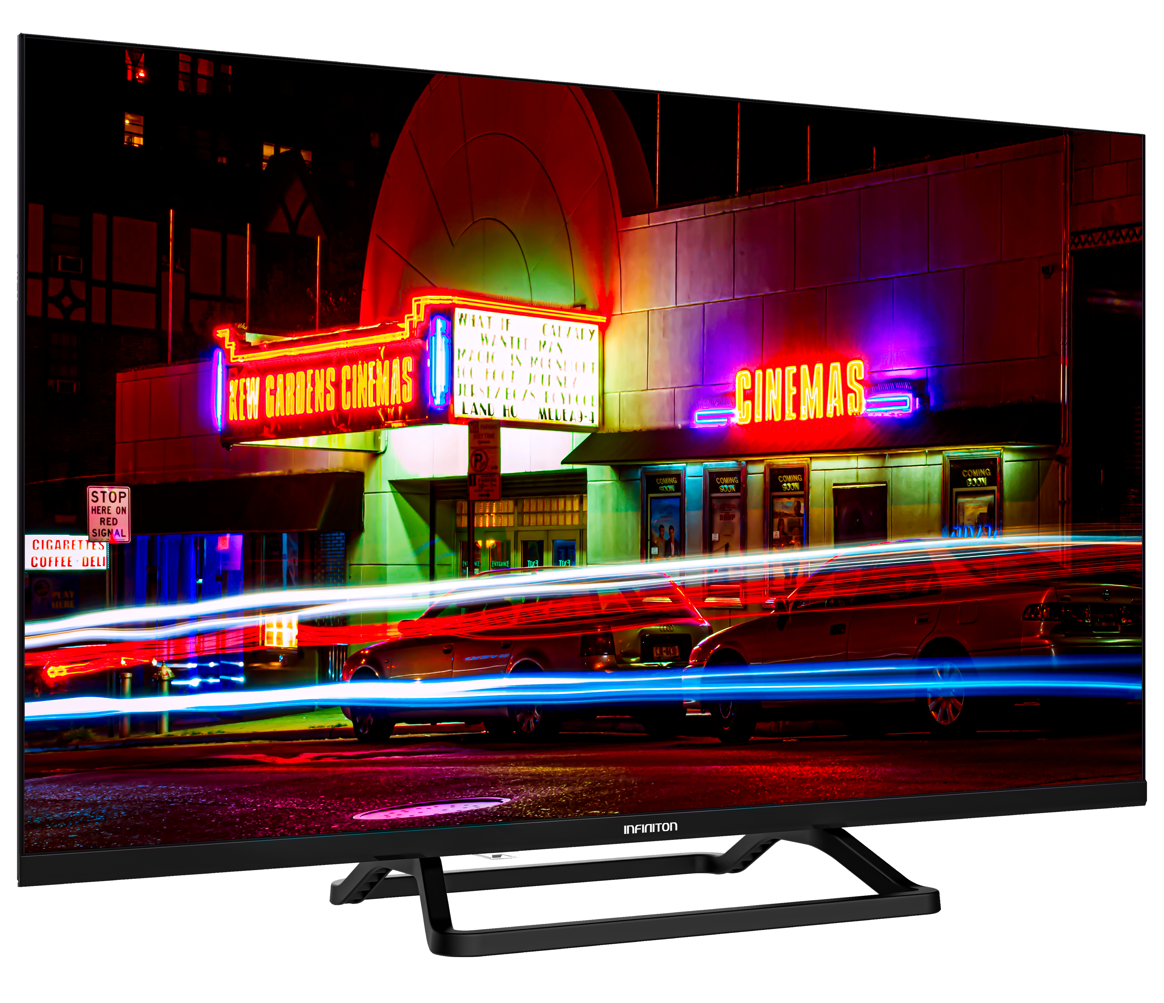 Un televisor de pantalla plana grande que muestra una escena callejera nocturna con un cine. Luces de neón brillantes.