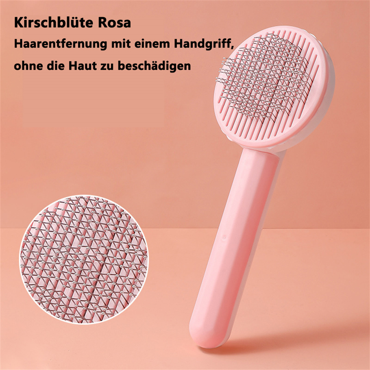 Rosa Haustierbürste mit rundem Kopf und Griff, Nahaufnahme des Bürstenkopfes.