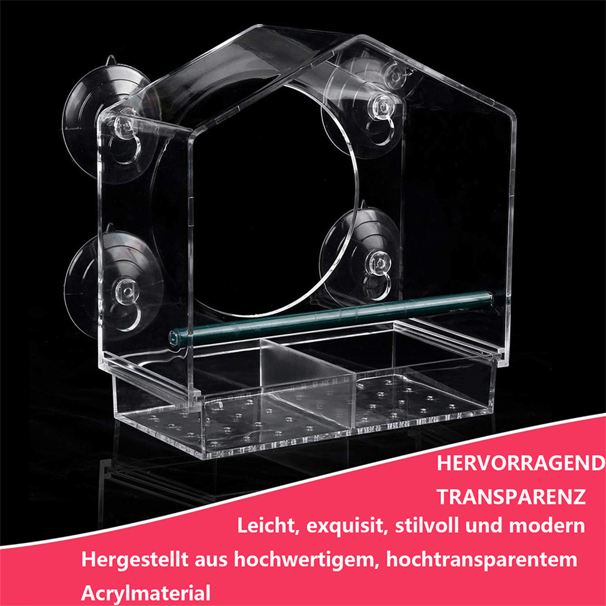 Transparenter Vogelfutterspender mit Saugnäpfen. Er ist transparent und hat eine Ablage.