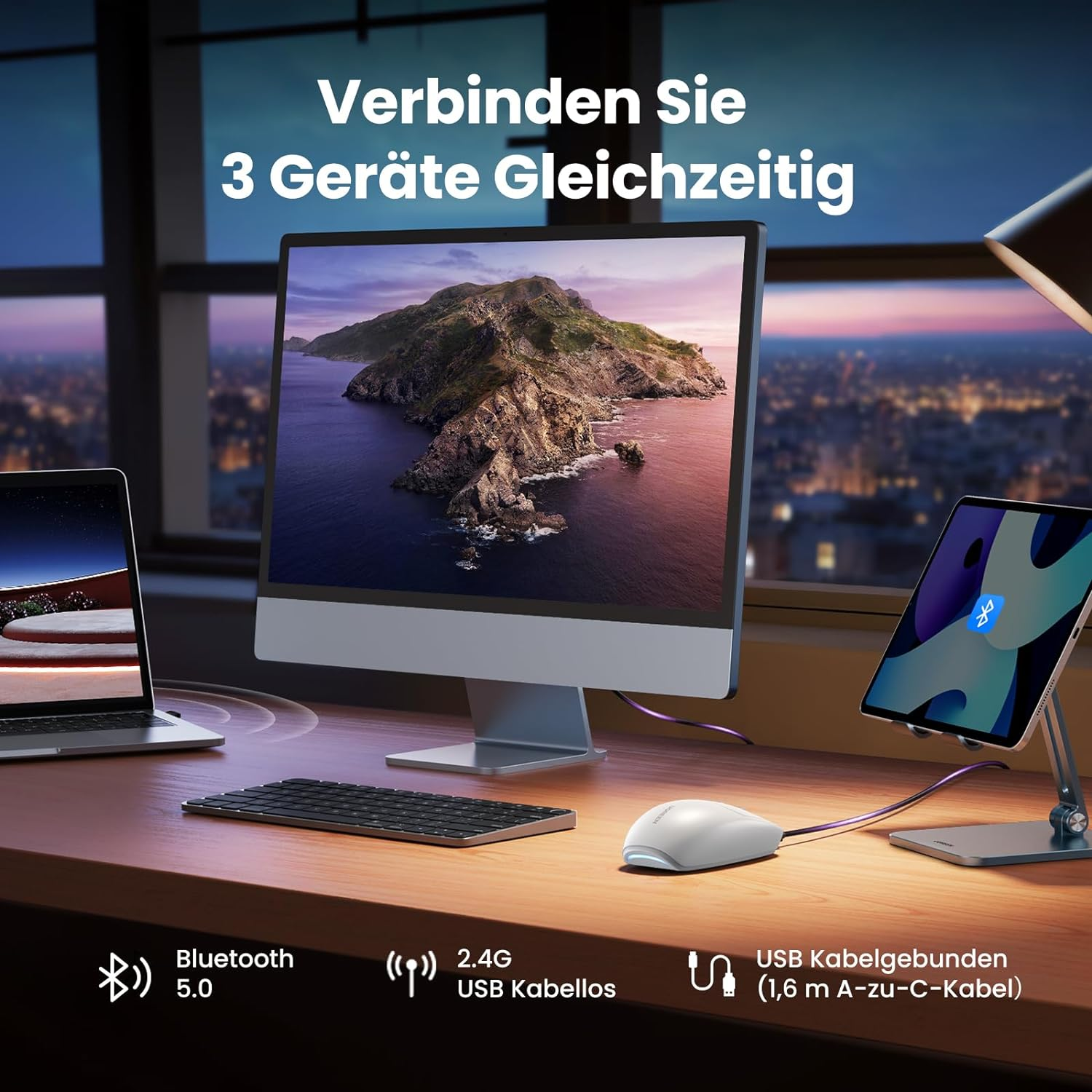 Ein Schreibtisch-Setup mit Computer, Monitor, Tastatur, Maus und Tablet.