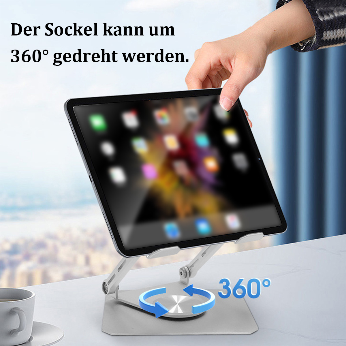 Tablet auf einem Ständer, eine Hand stellt es ein. Text: 'Der Sockel kann 360° gedreht werden'.