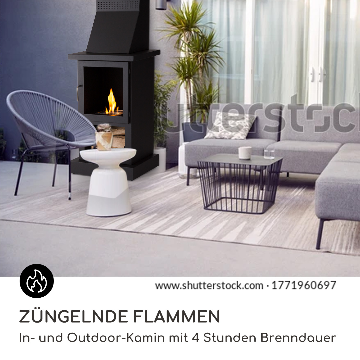 Außenkamin mit Flammen, ein weißer Beistelltisch und eine graue Couch auf einer Terrasse.