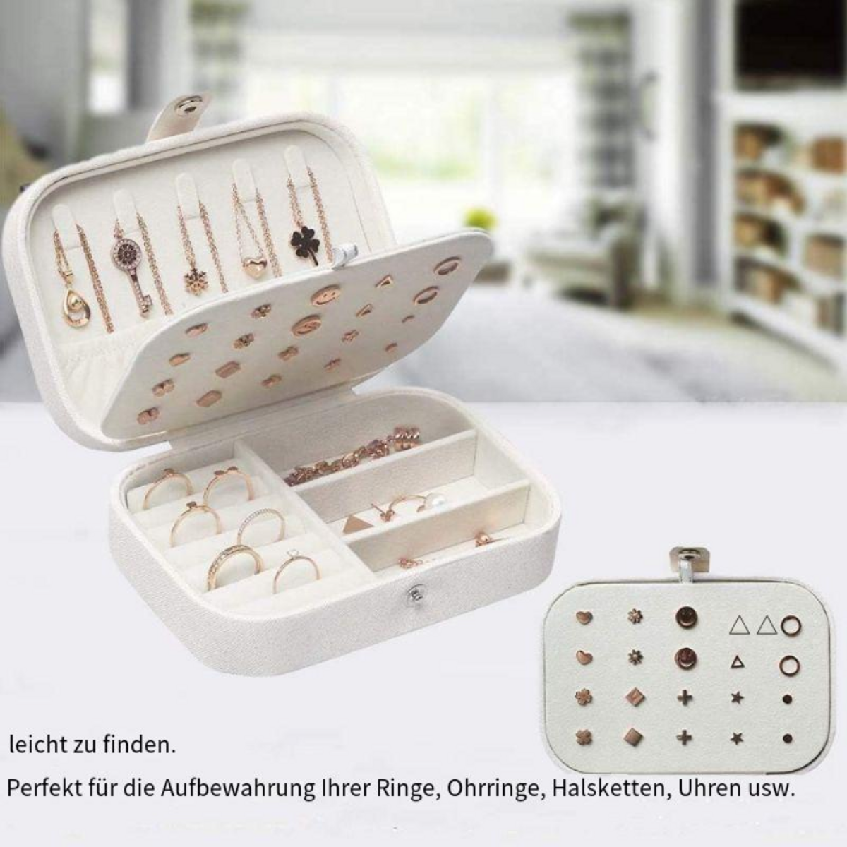 Schmuckkästchen mit offenem Deckel und Schmuck. Die Box ist weiß, und es gibt viele Ringe und Ohrringe.
