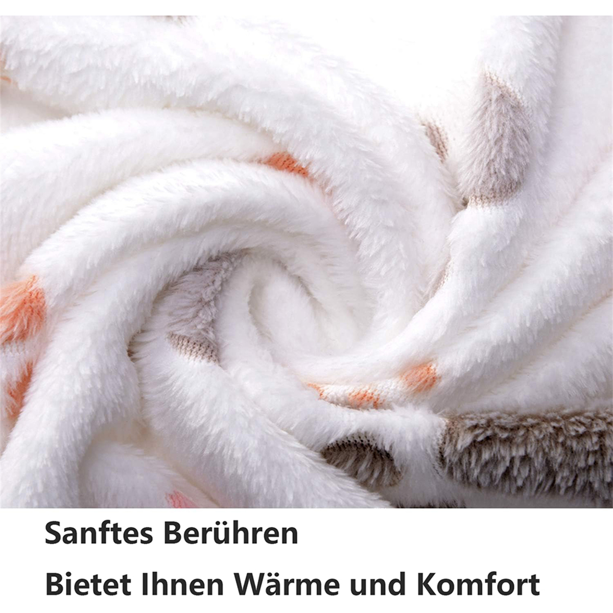 Weiche, weiße Decke mit orangefarbenen und braunen Tupfen. Nahaufnahme.