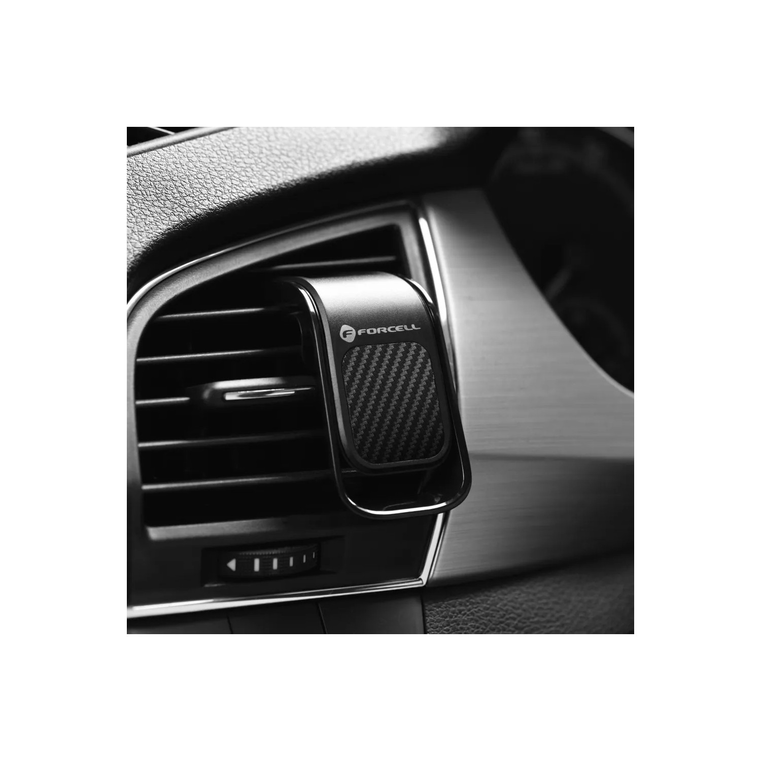 Ein schwarzer und silberner Handyhalter für die Lüftung im Auto, mit Karbonfaser-Textur.