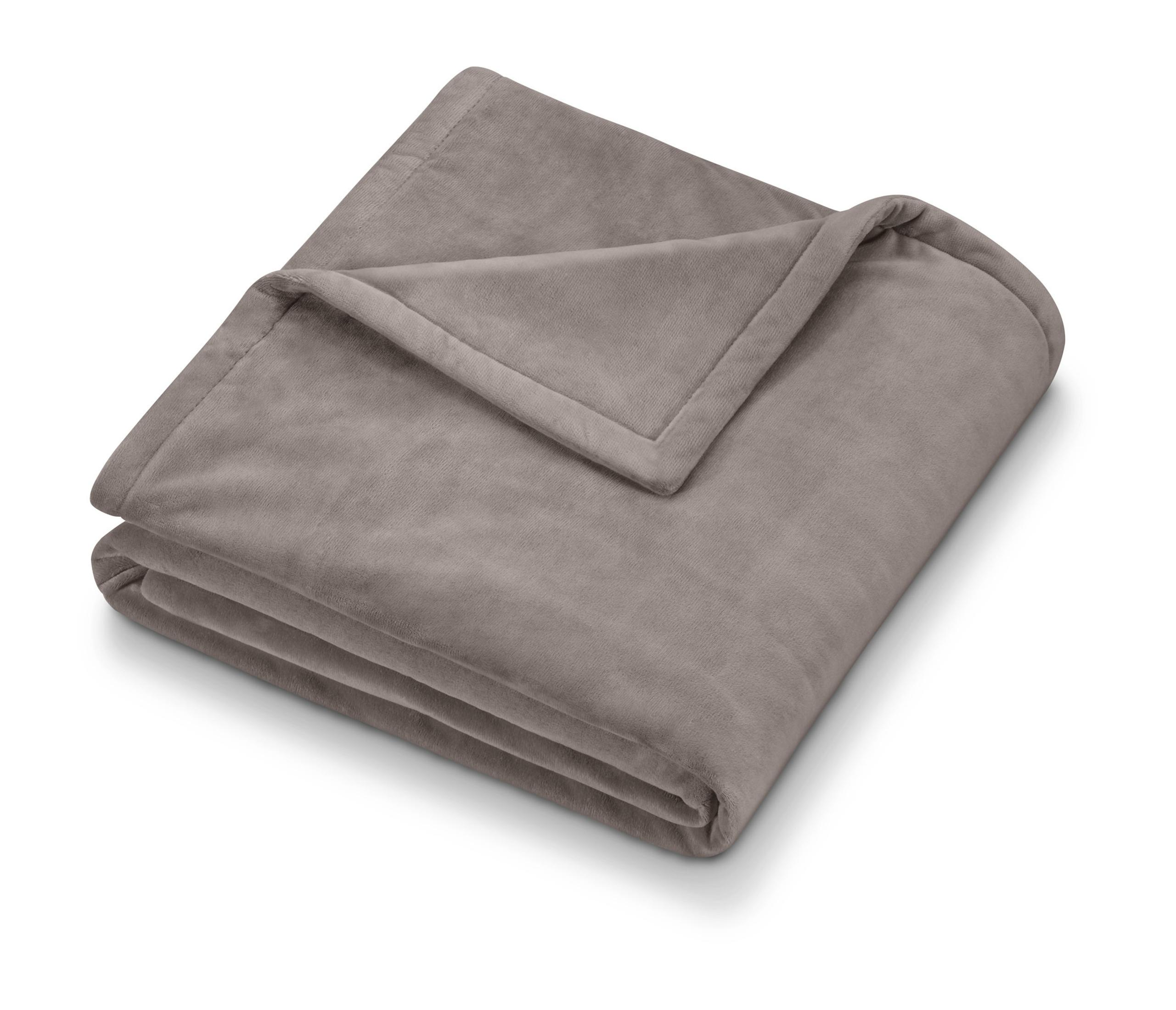 A folded, taupe-colored blanket. The top corner is folded over, with a slight shadow.