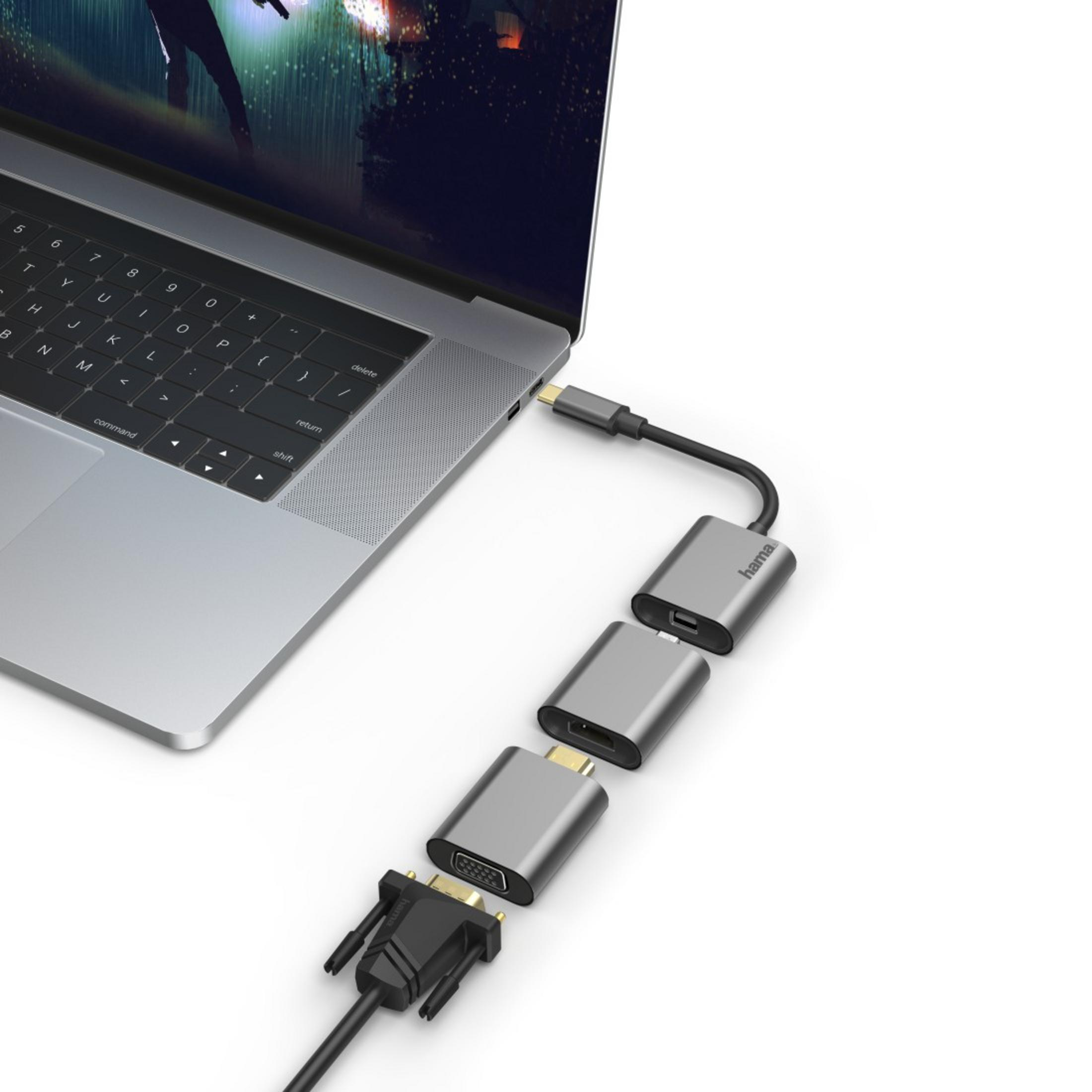 Laptop podłączony do kilku adapterów. Adaptery zawierają porty HDMI, VGA i USB.