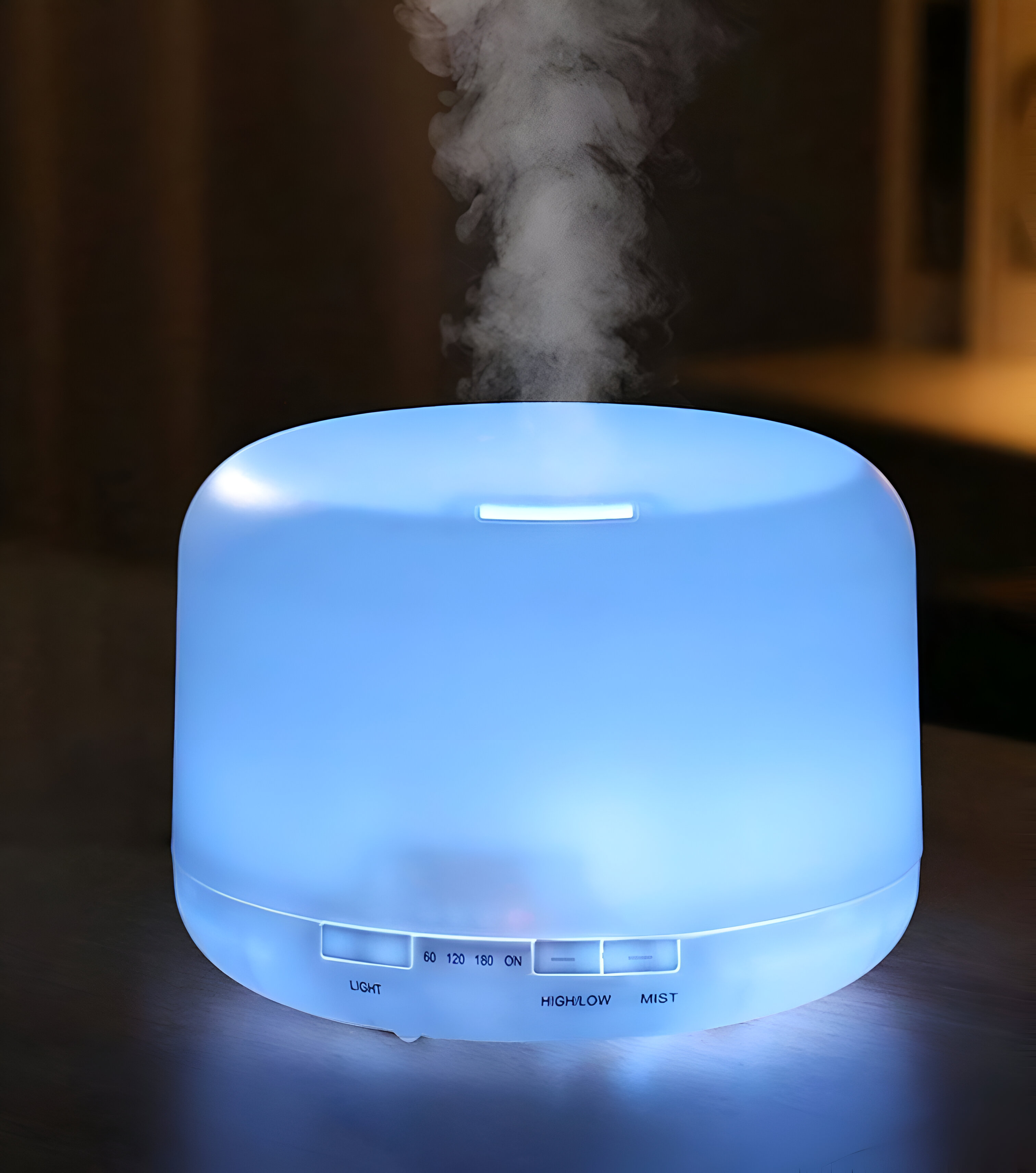 Humidificador azul con niebla ascendente. Botones: Luz, 60, 120, 180, Encendido, Alto/Bajo, Niebla. Fondo oscuro.