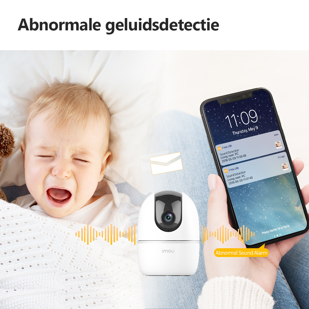 Płaczące dziecko w pobliżu kamery. Telefon pokazuje alarm: nieprawidłowy dźwięk.