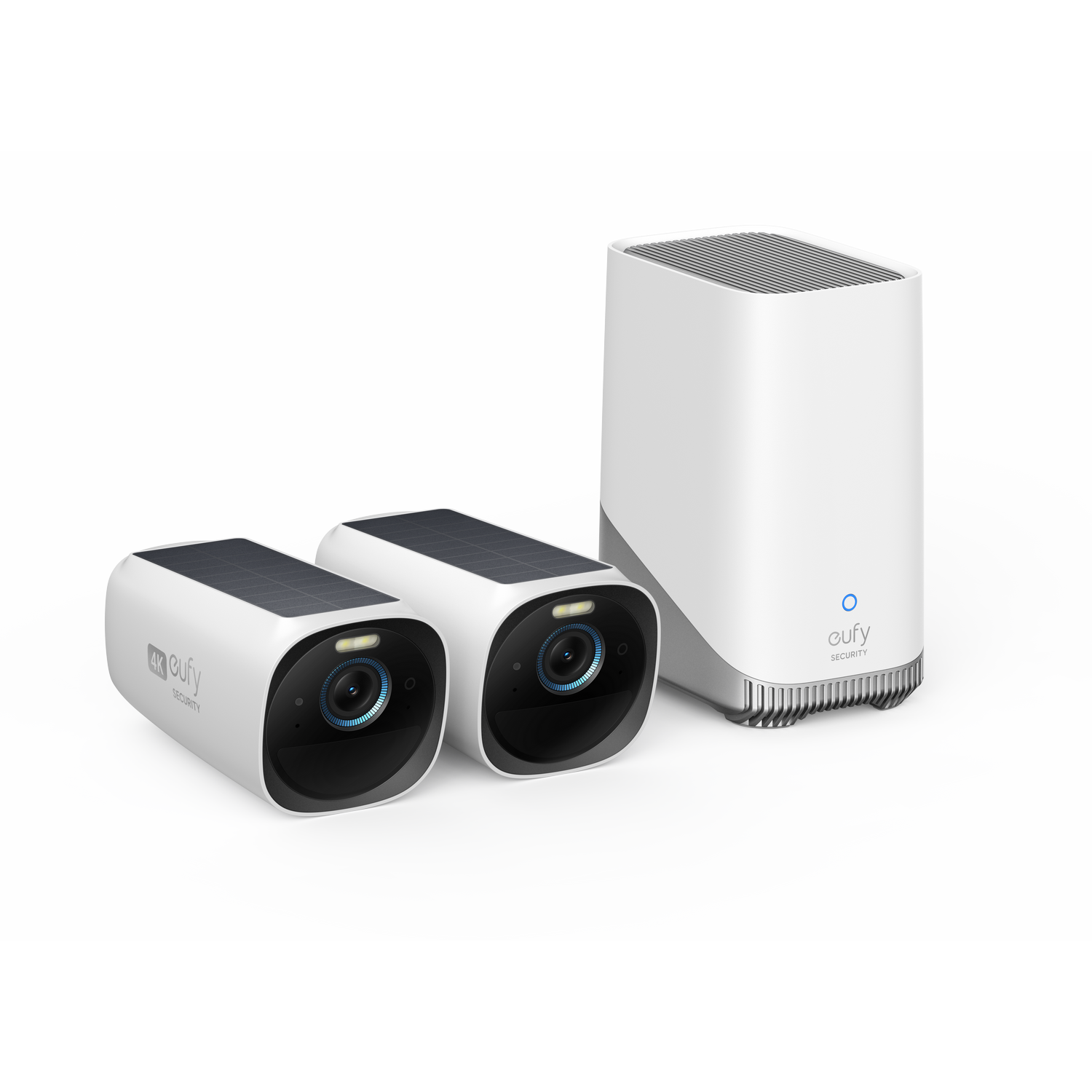 Dwie białe kamery bezpieczeństwa z panelami słonecznymi i jednostką bazową. Kamery skierowane na zewnątrz, jednostka pionowa.