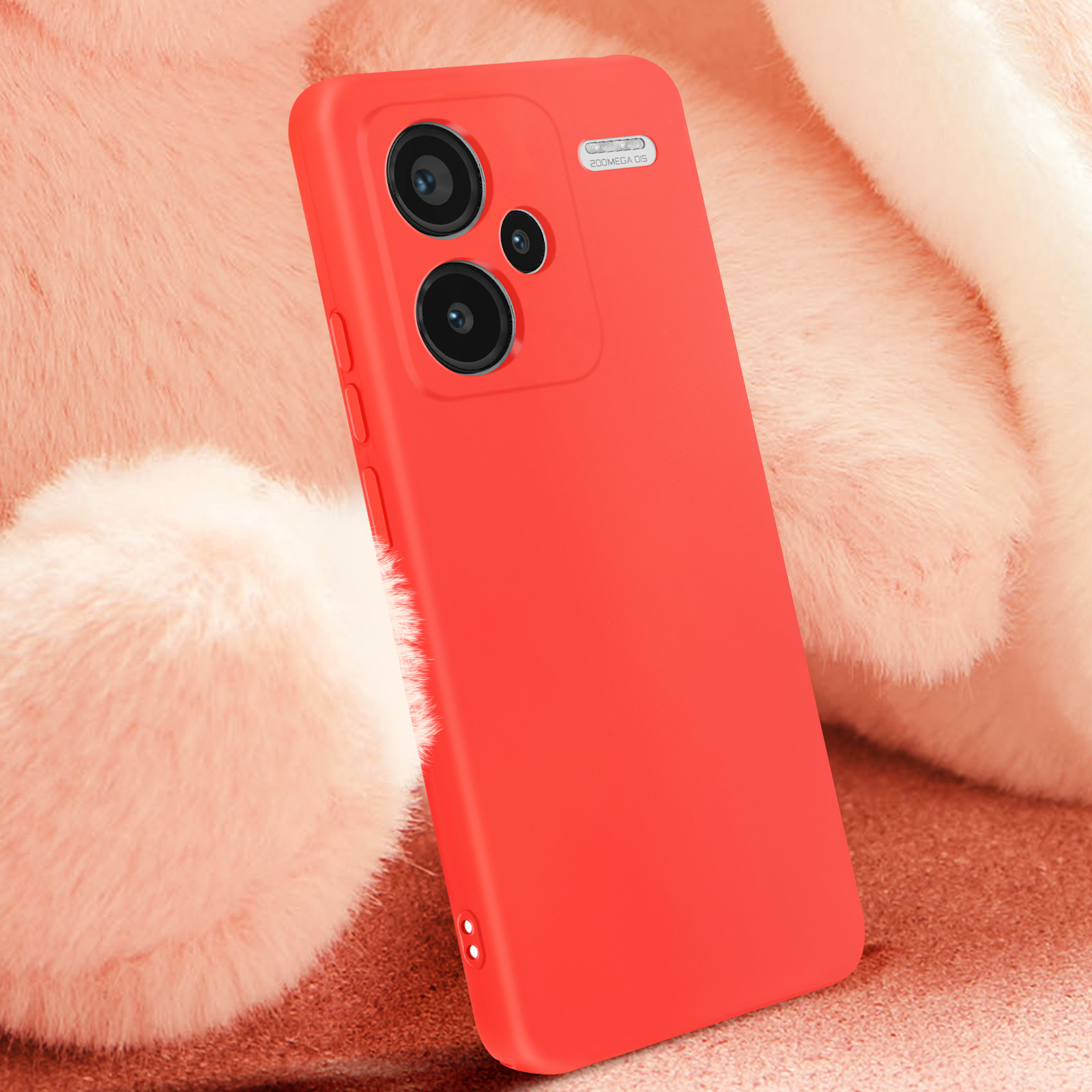 Funda de teléfono roja sobre una superficie rosa difusa. Dos cámaras visibles.