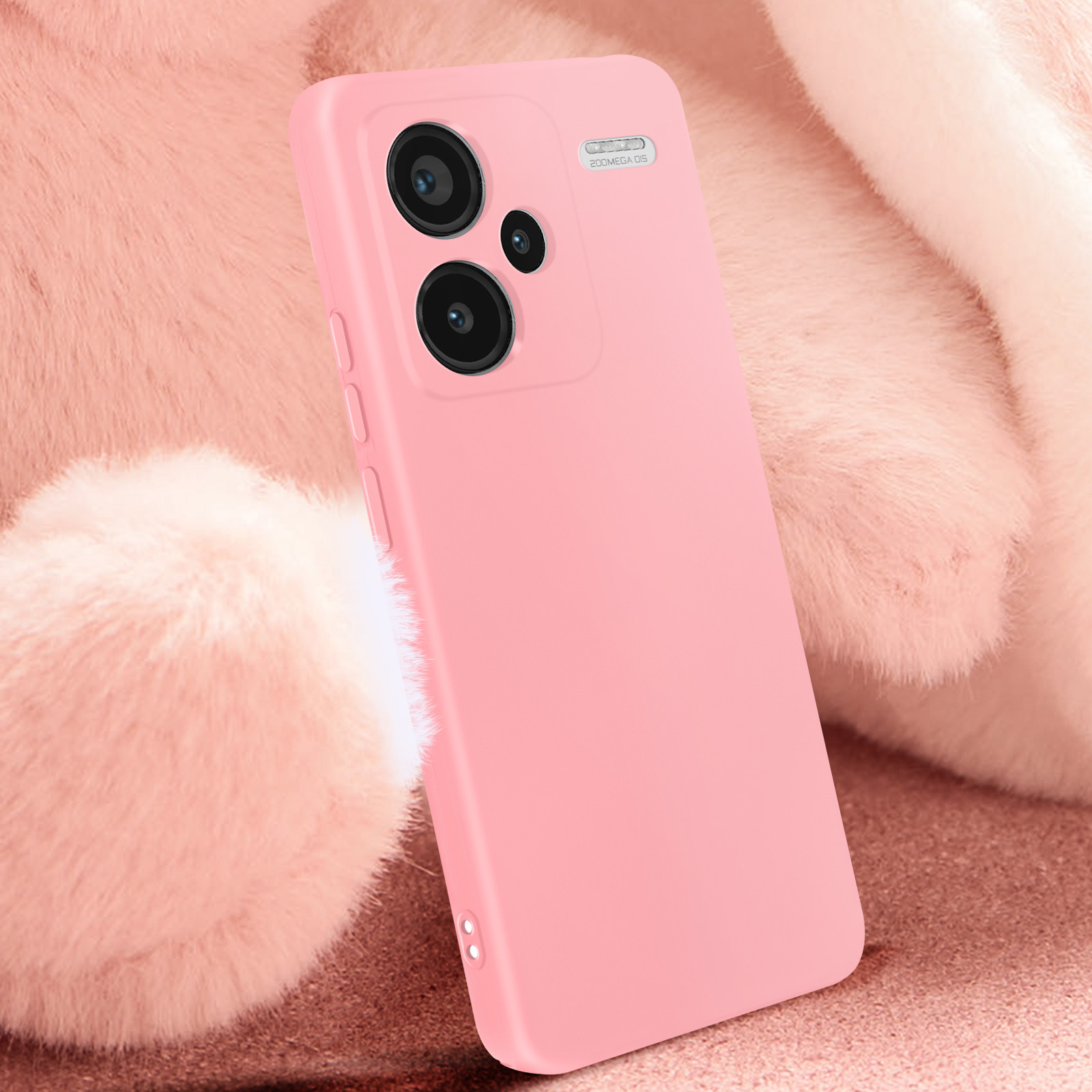 Una funda de teléfono rosa sobre una superficie suave y difusa rosa. La funda tiene una protuberancia para la cámara.