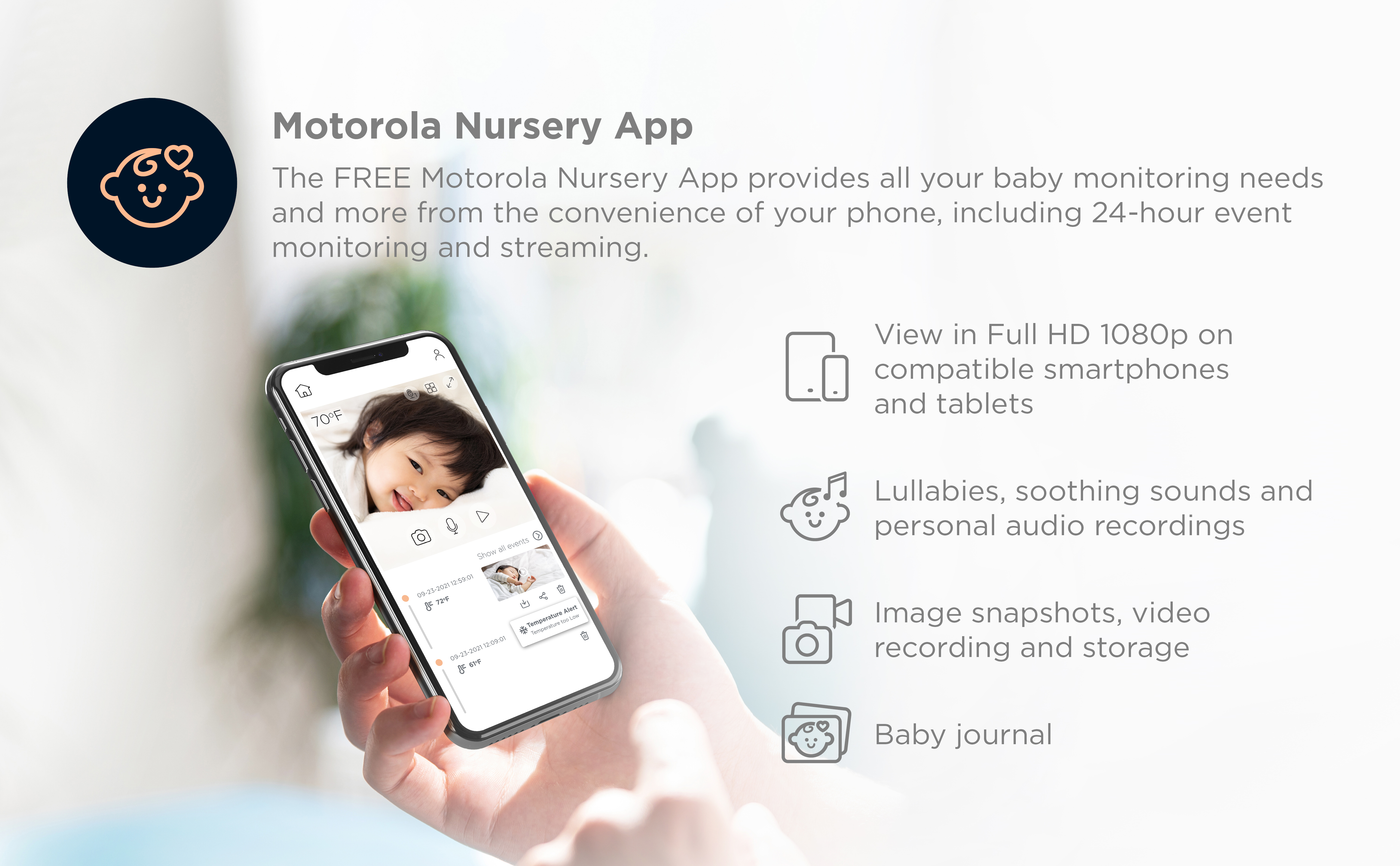 Hand holding a phone showing a baby monitor app interface. Text and icons.