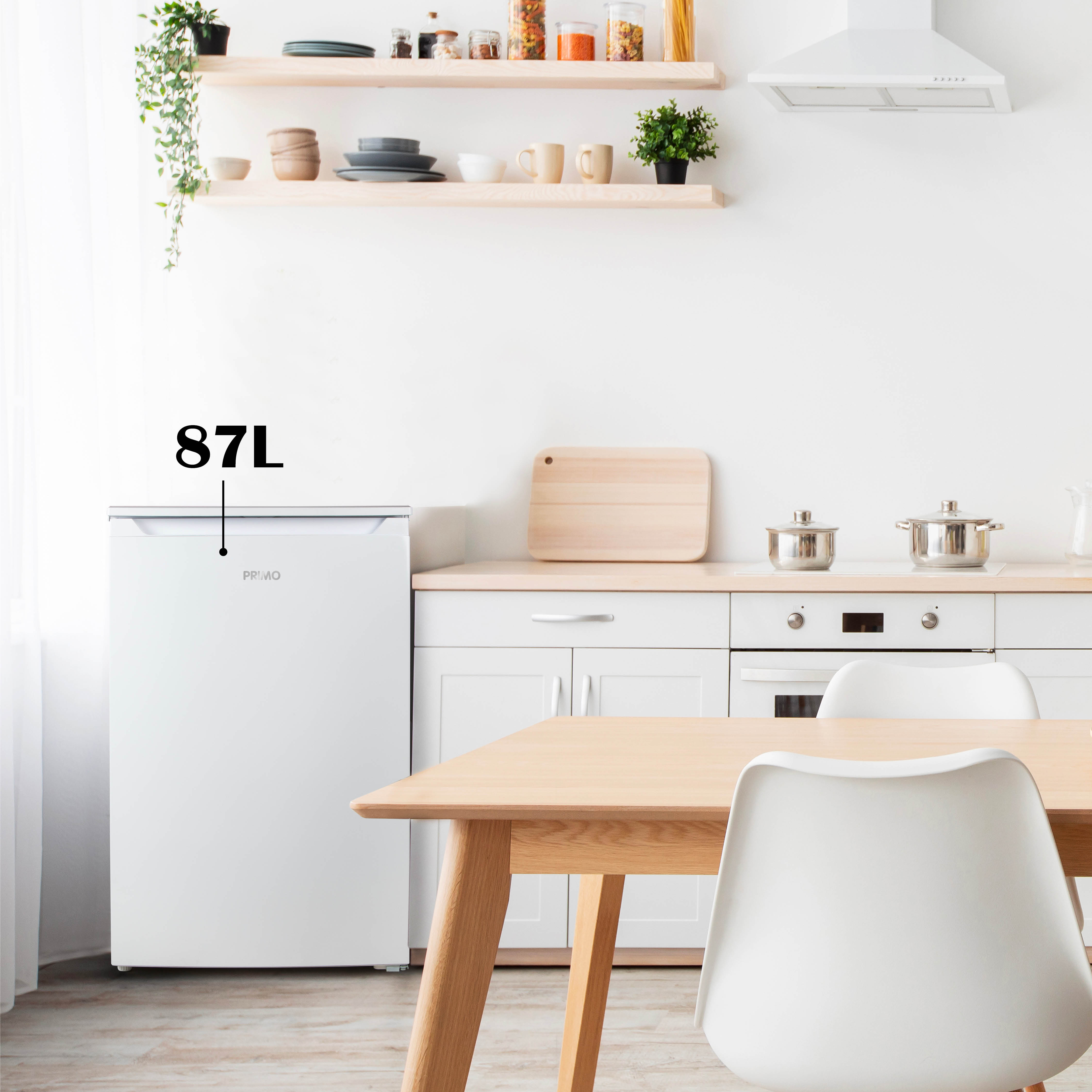 A white refrigerator with a handle. The refrigerator is in a kitchen with a wooden table and white chairs.