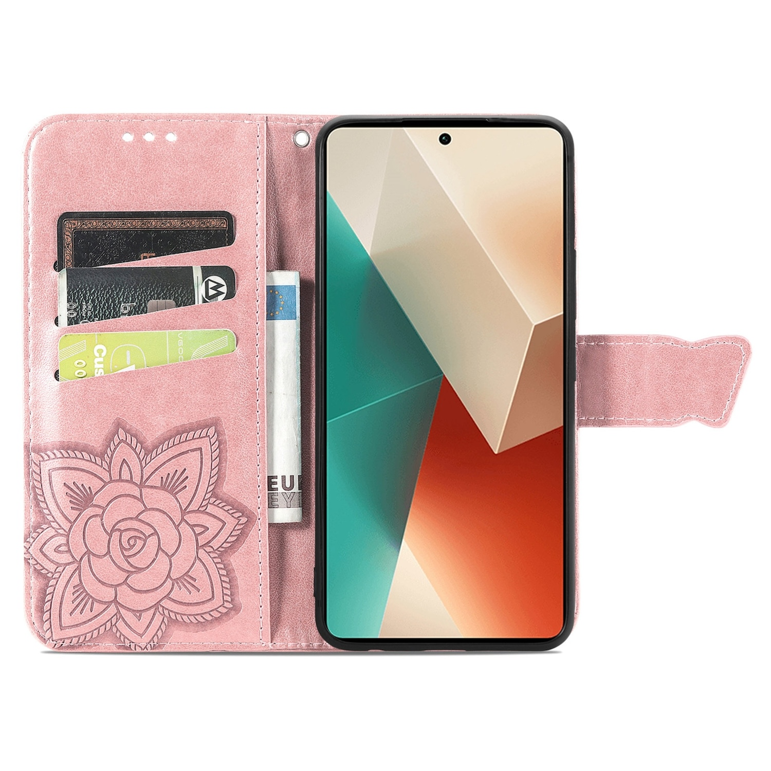 Pinkfarbene Handyhülle, geöffnet, mit Karten und Geld. Blume links, Telefon innen.