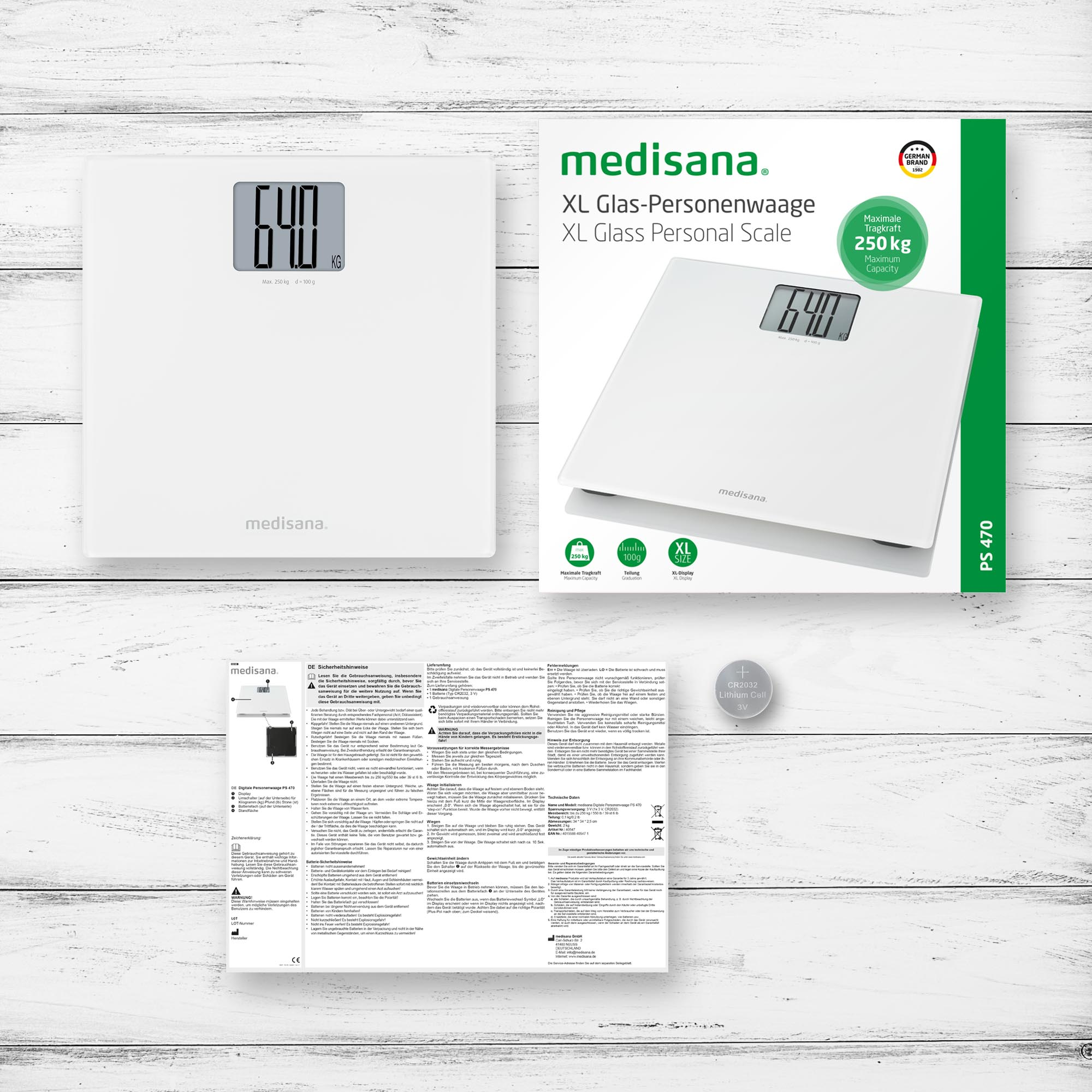 Biała waga z wyświetlaczem cyfrowym, pokazuje 64,0 kg. Opakowanie i dokumentacja widoczne.