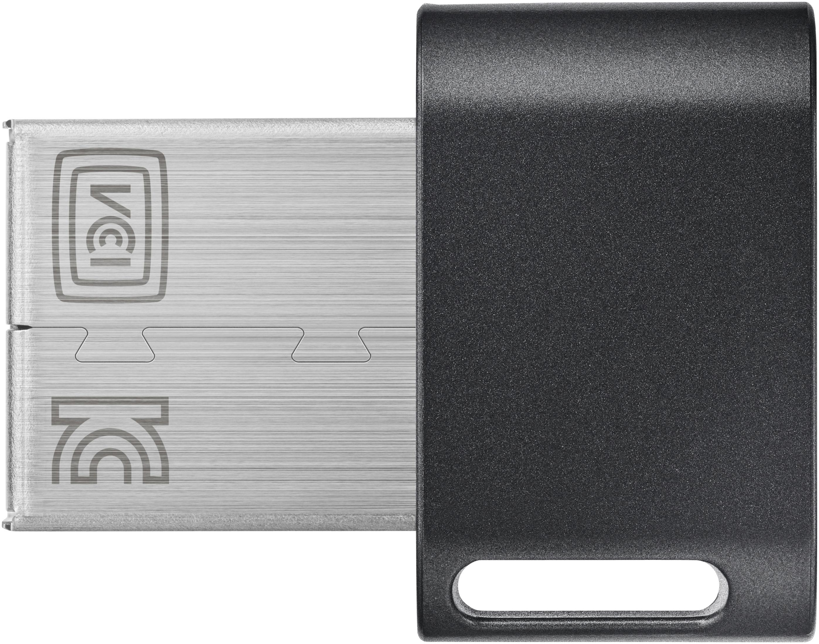 Una unidad USB plateada con una tapa negra, que muestra los logotipos VGI y KC, sobre un fondo blanco.