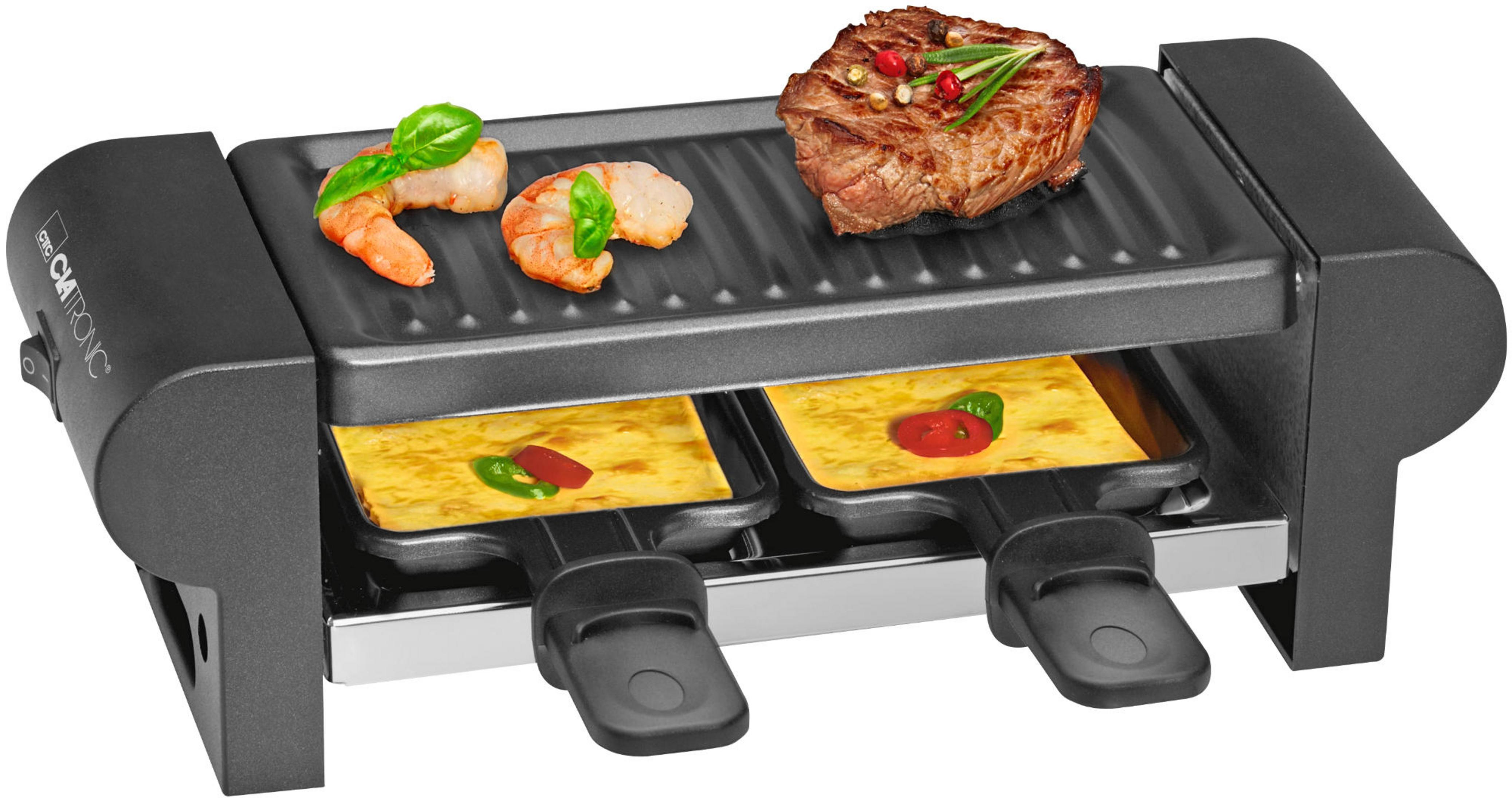 Czarny grill do raclette z krewetkami, stekiem, serem i dodatkami z czerwonej papryki.