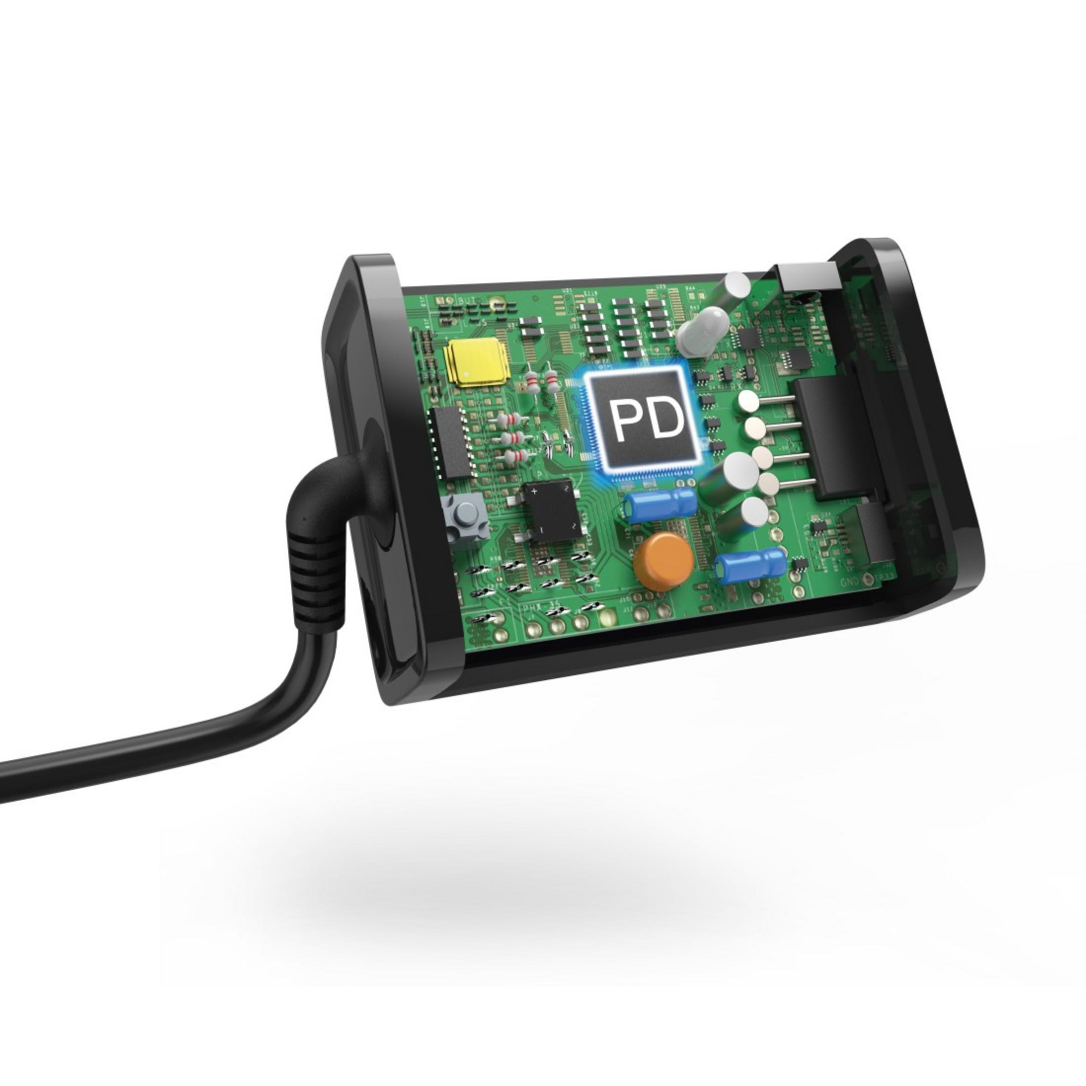 Czarna ładowarka częściowo otwarta, pokazująca płytkę drukowaną. Podłączony czarny kabel.