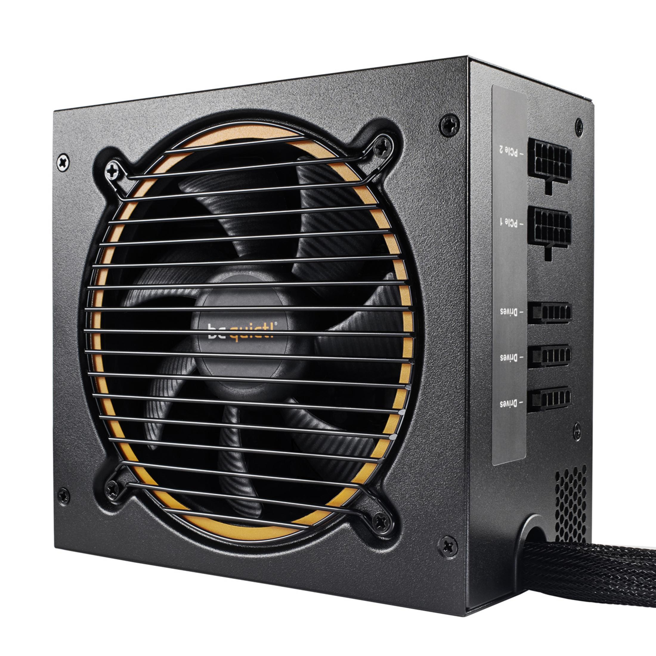 Alimentatore per computer nero con ventola, griglia e porte connettore.