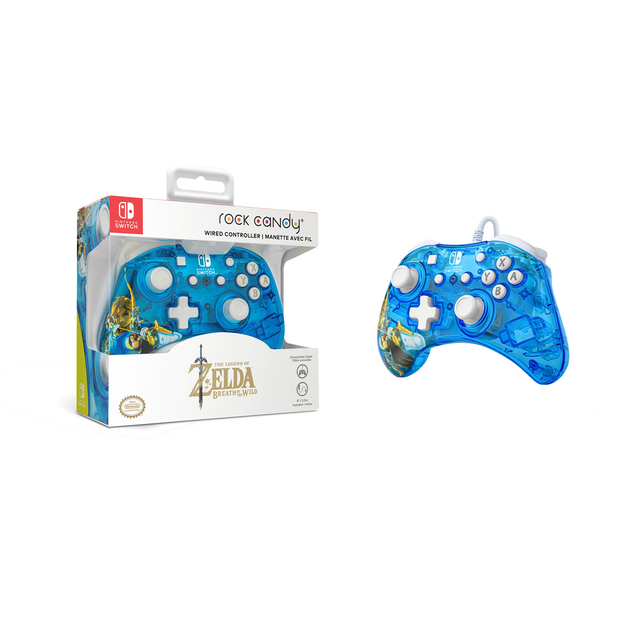 Niebieski kontroler Nintendo Switch z motywem Zelda w pudełku i drugi obok.
