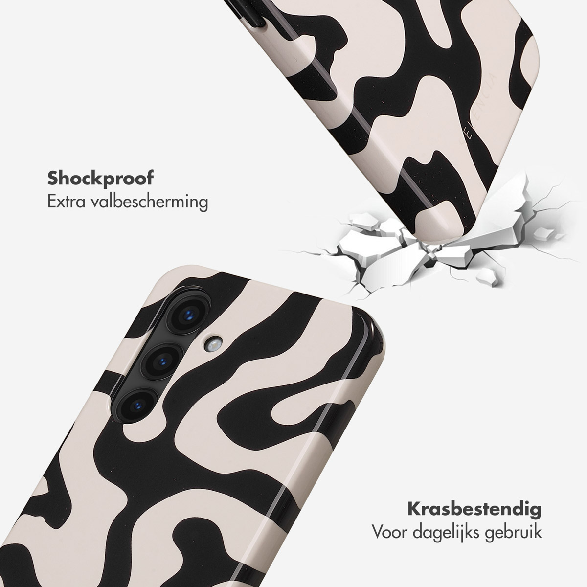 Schokbestendige telefoonhoes met zwart-wit patroon, valt naar beneden.