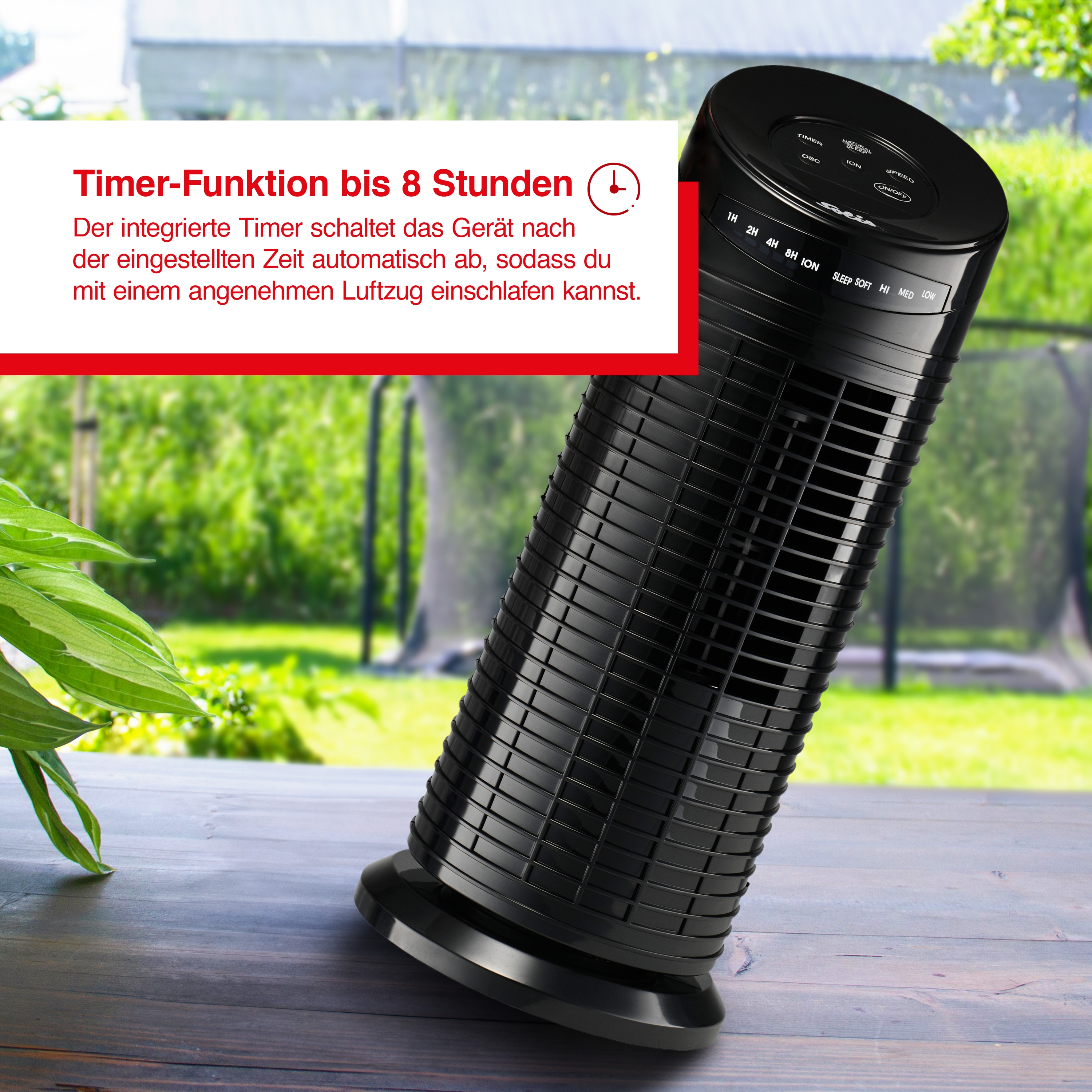 Ein schwarzer Ventilator auf einem Holztisch mit Text.