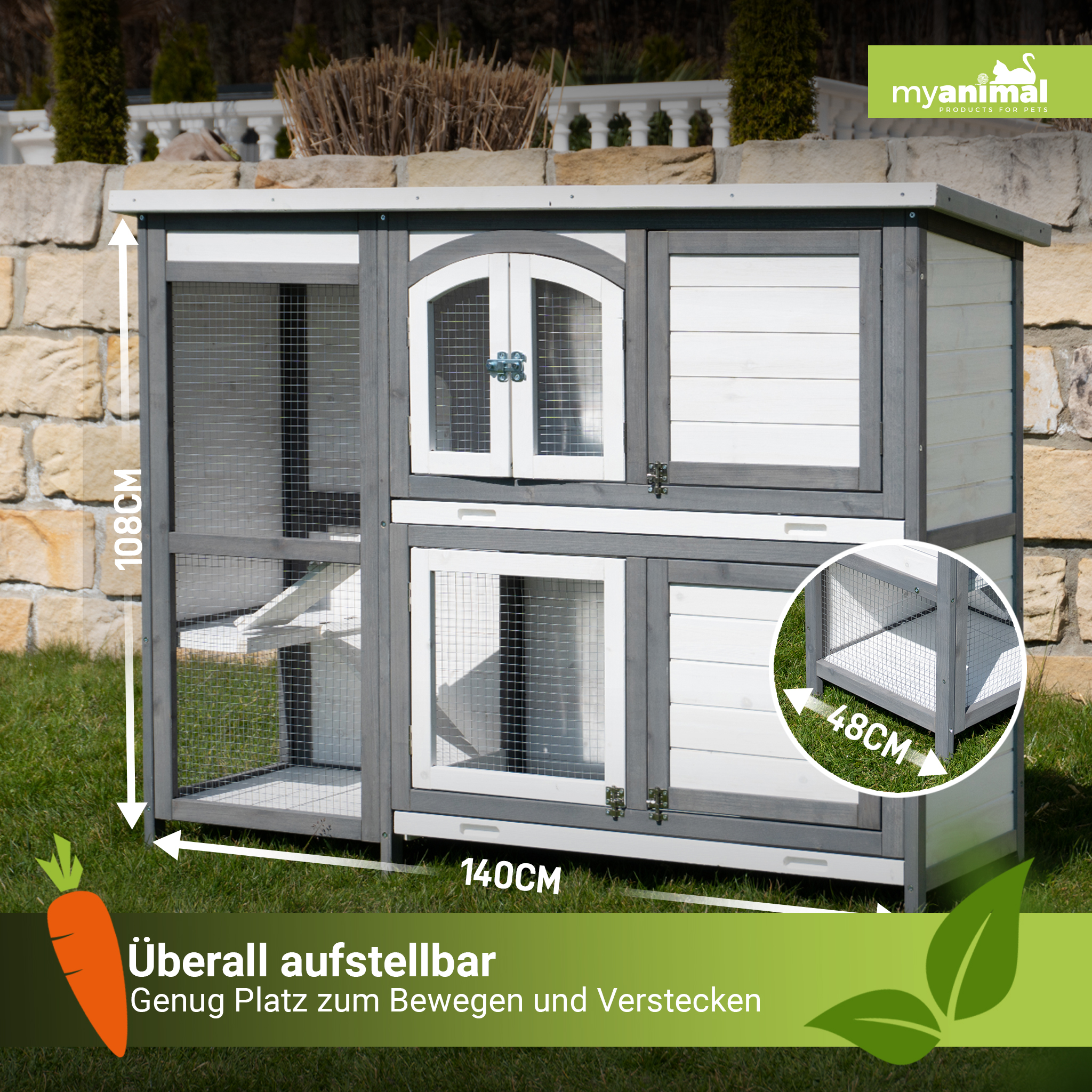 Kaninchenstall aus Holz mit mehreren Fächern, Abmessungen und grünem Gras.